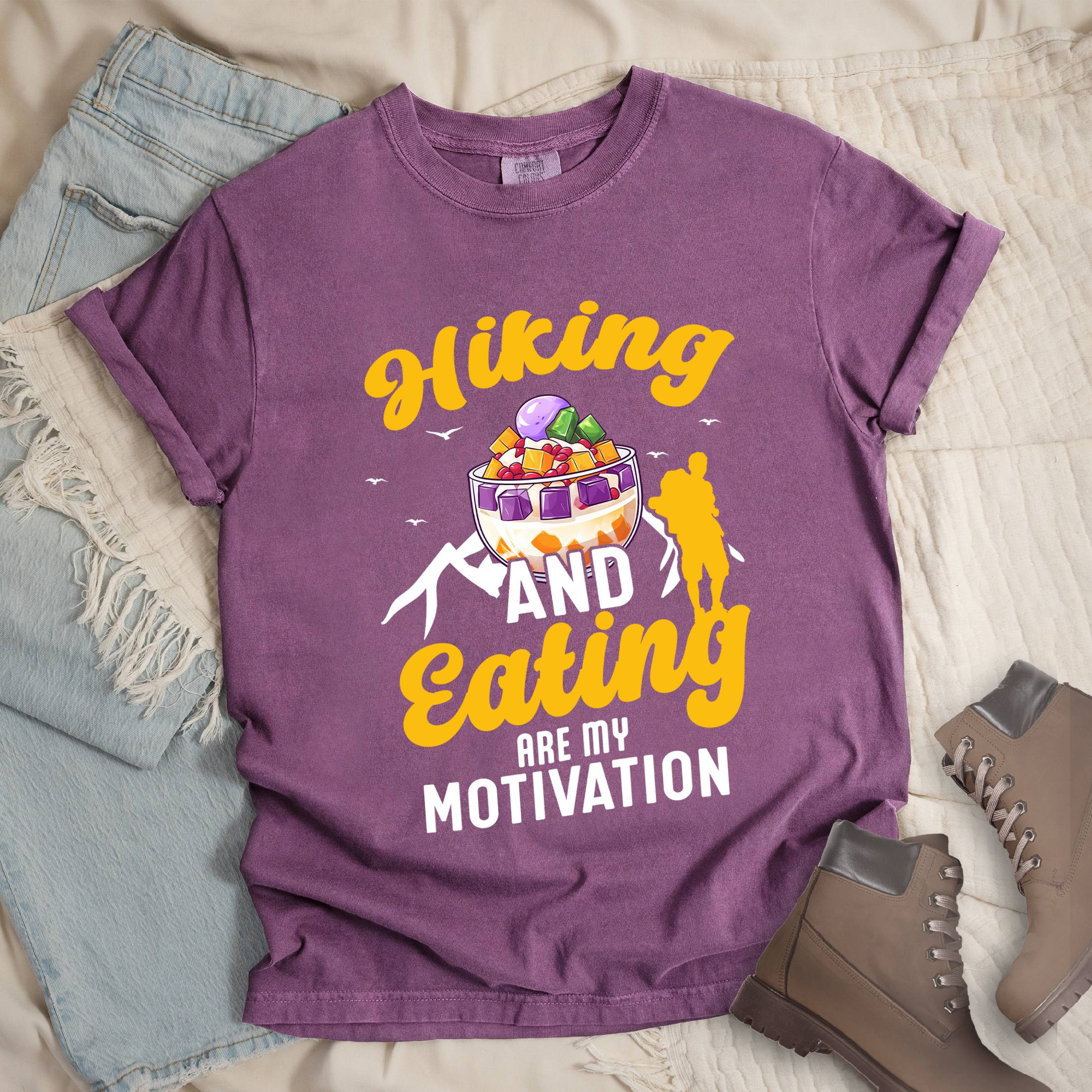 Dark pink shirt with Hiking Design featuring the phrase “Hiking and Eating Are My Motivation” and an illustration of halo-halo in a bowl.