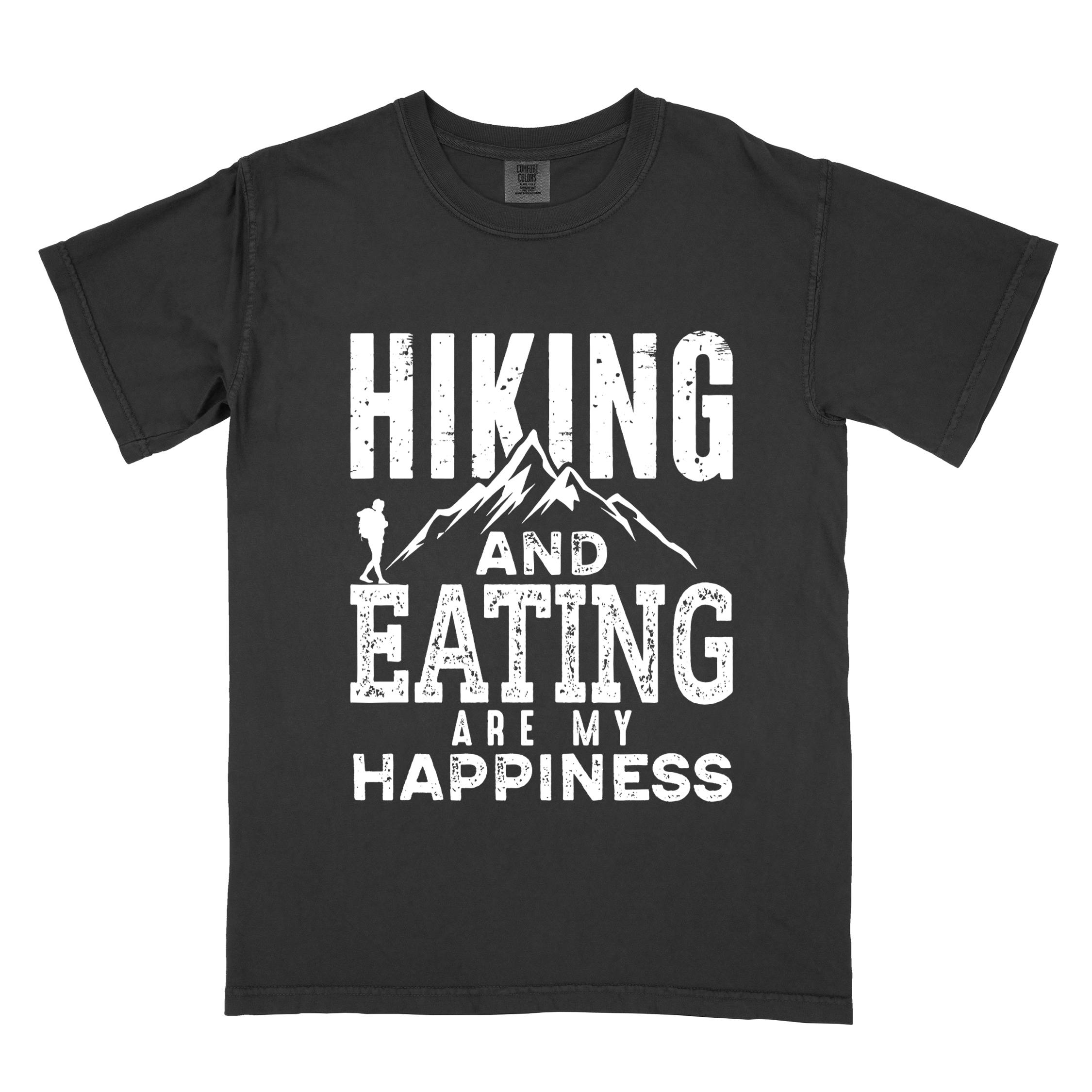Black "Hiking and Eating are my happiness" colored statement tee with bold typography, mountains, birds, perfect for adventure motivated individuals.