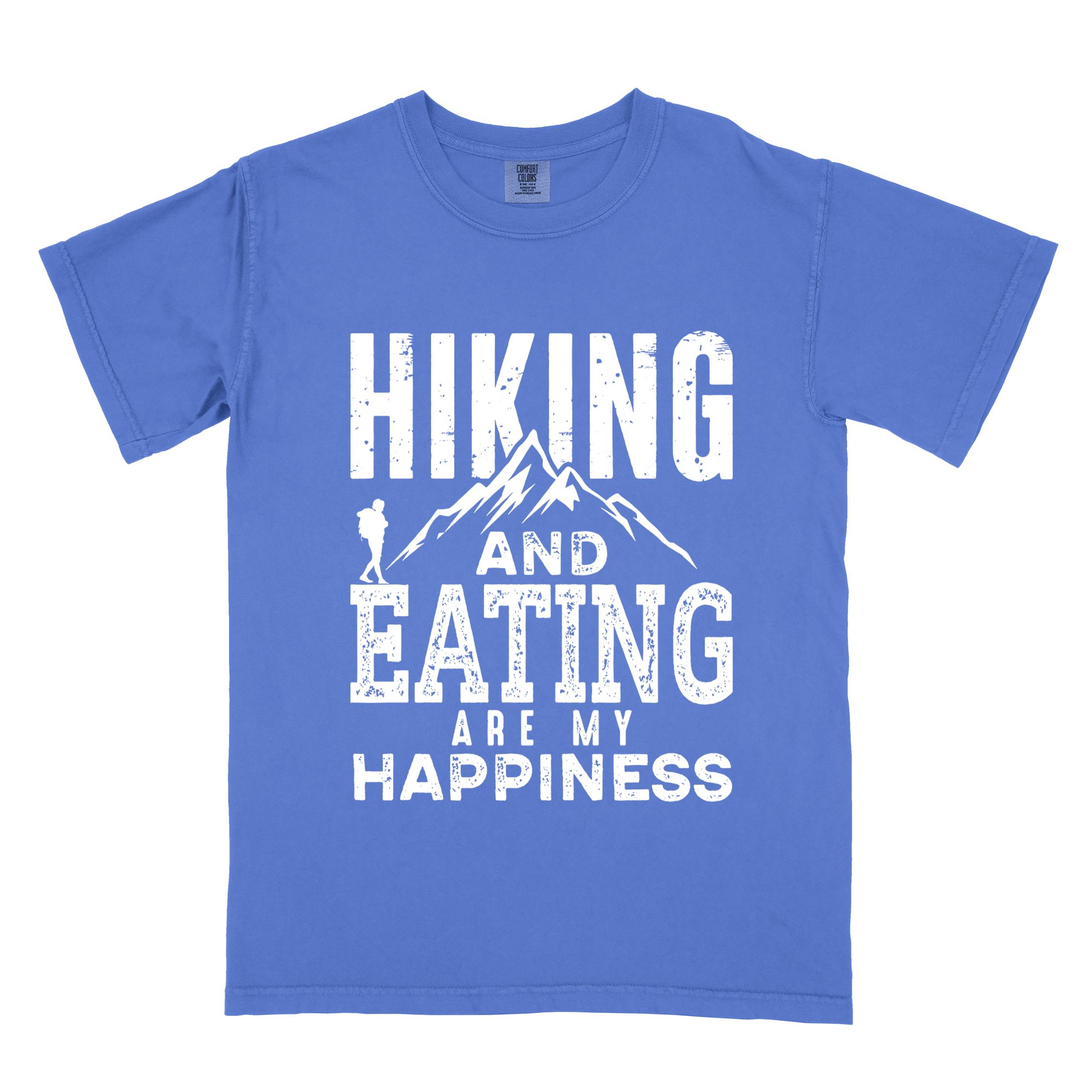 Flo blue "Hiking and Eating are my happiness" colored statement tee with bold typography, mountains, birds, perfect for adventure motivated individuals.