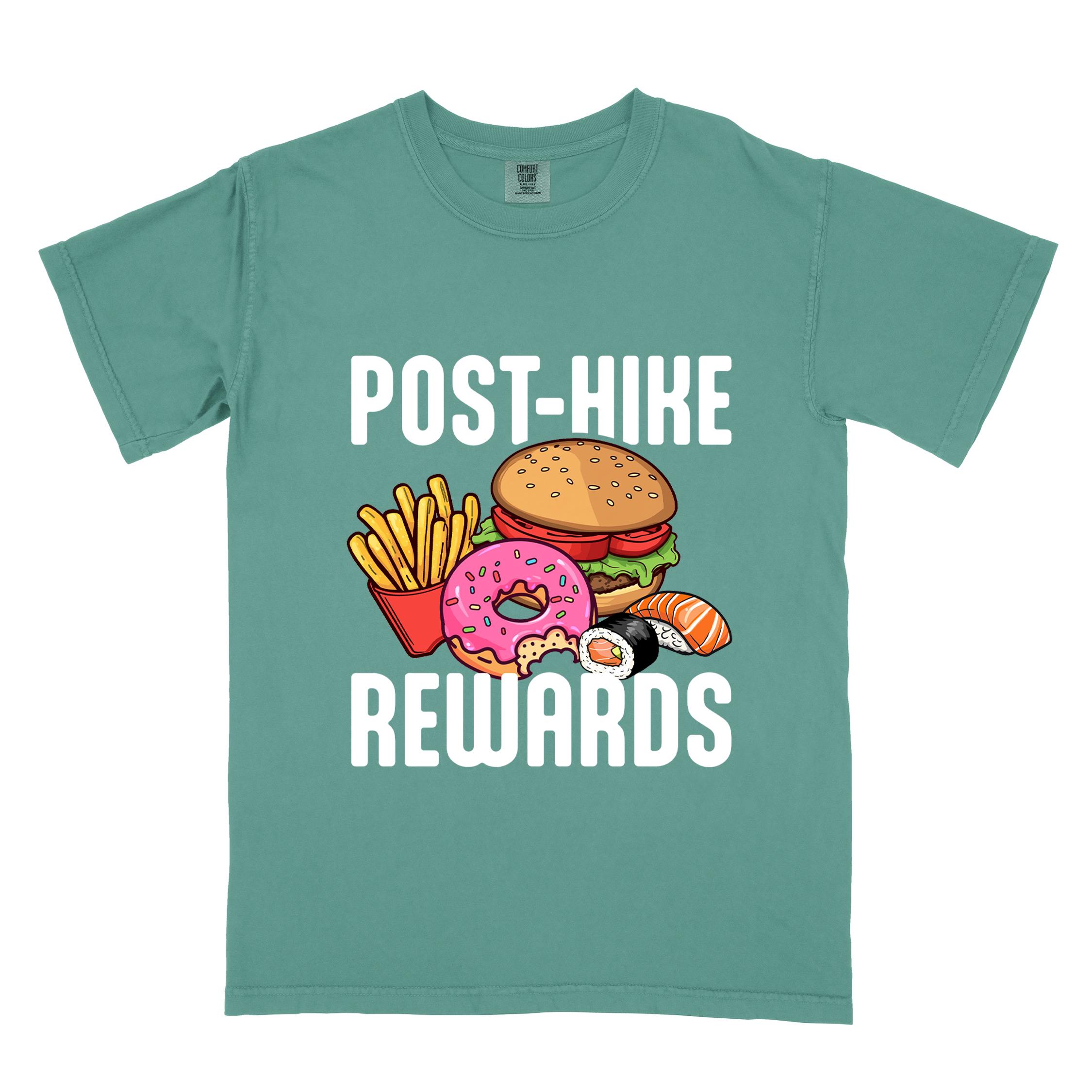 Light green "Post-hike rewards" colored statement tee with bold typography, mountains, birds, illustrated fast food meal, perfect for adventure motivated individuals and looking for post-hike meal.