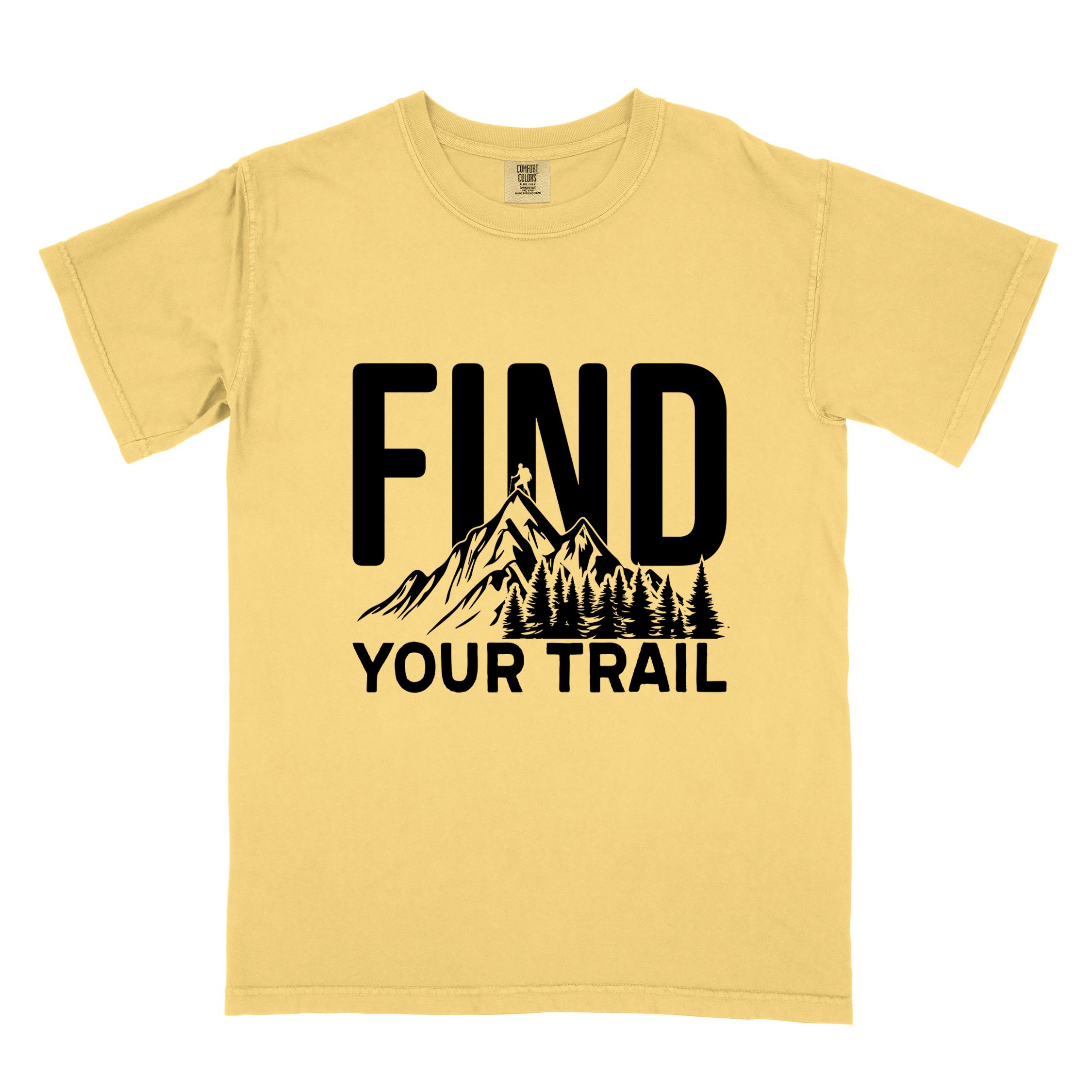 Butter "Find your trail" colored statement tee with bold typography, mountains, birds, perfect for adventure motivated individuals.