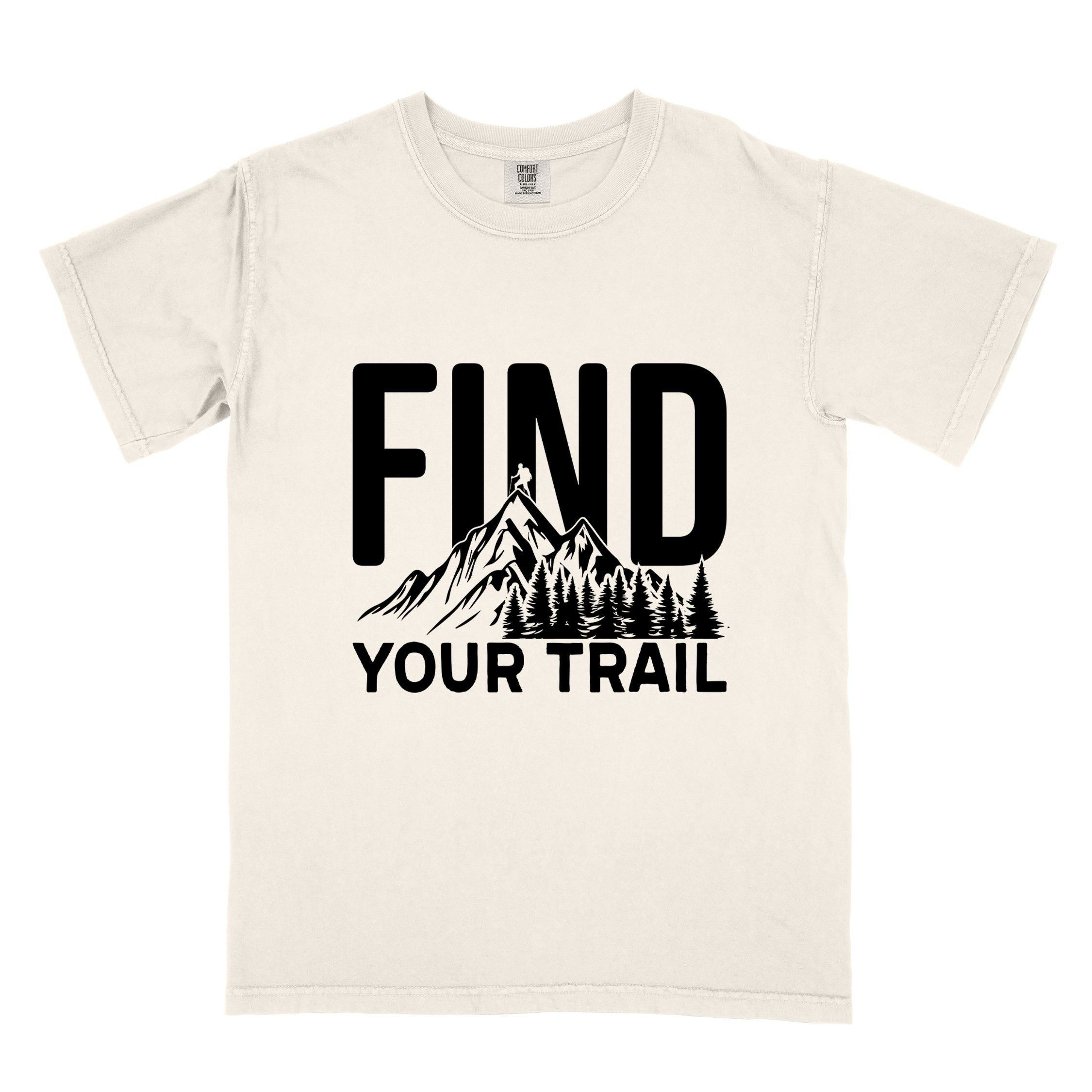 Ivory  "Find your trail" colored statement tee with bold typography, mountains, birds, perfect for adventure motivated individuals.