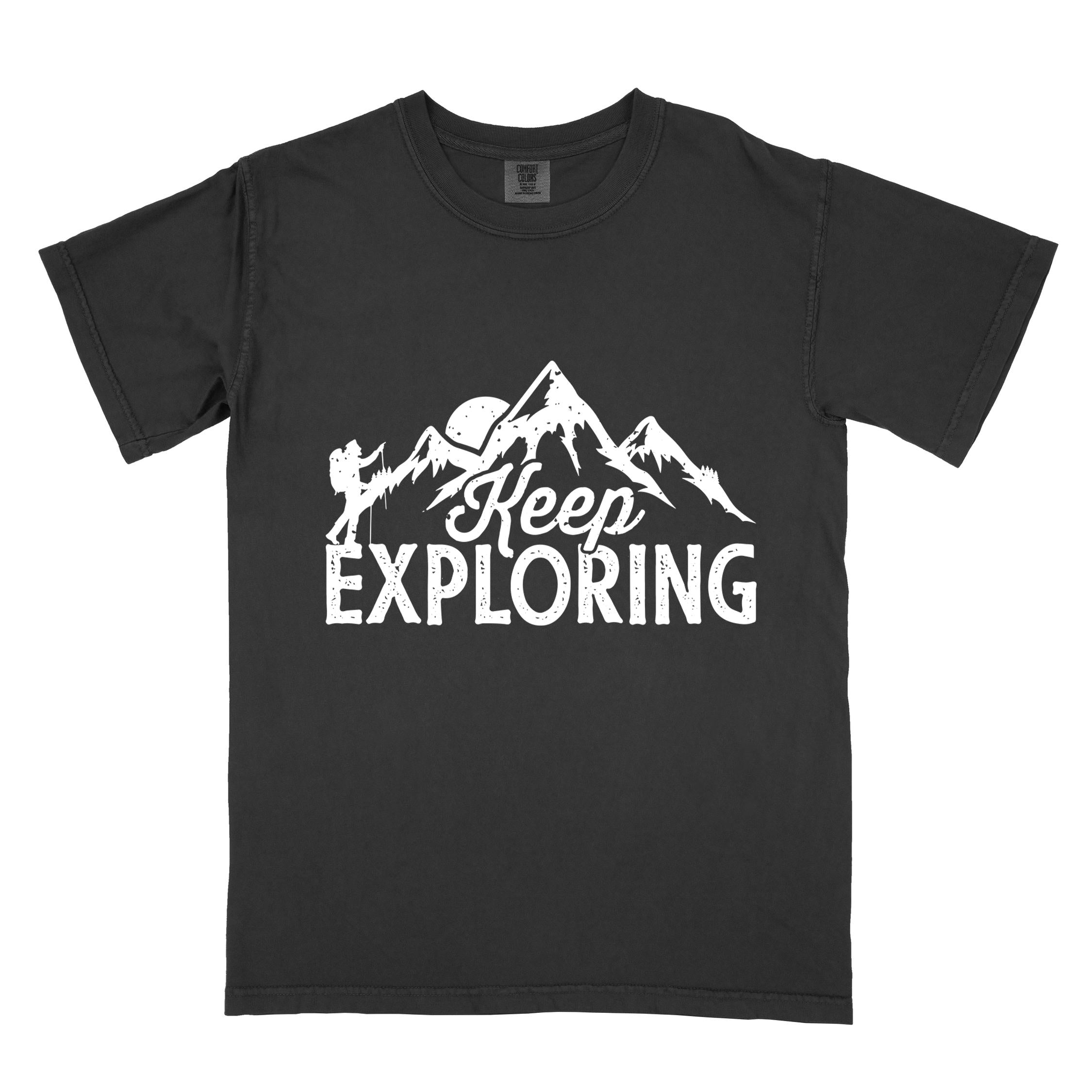 Black "Keep Exploring" colored statement tee with bold typography, mountains, birds, perfect for adventure motivated individuals.