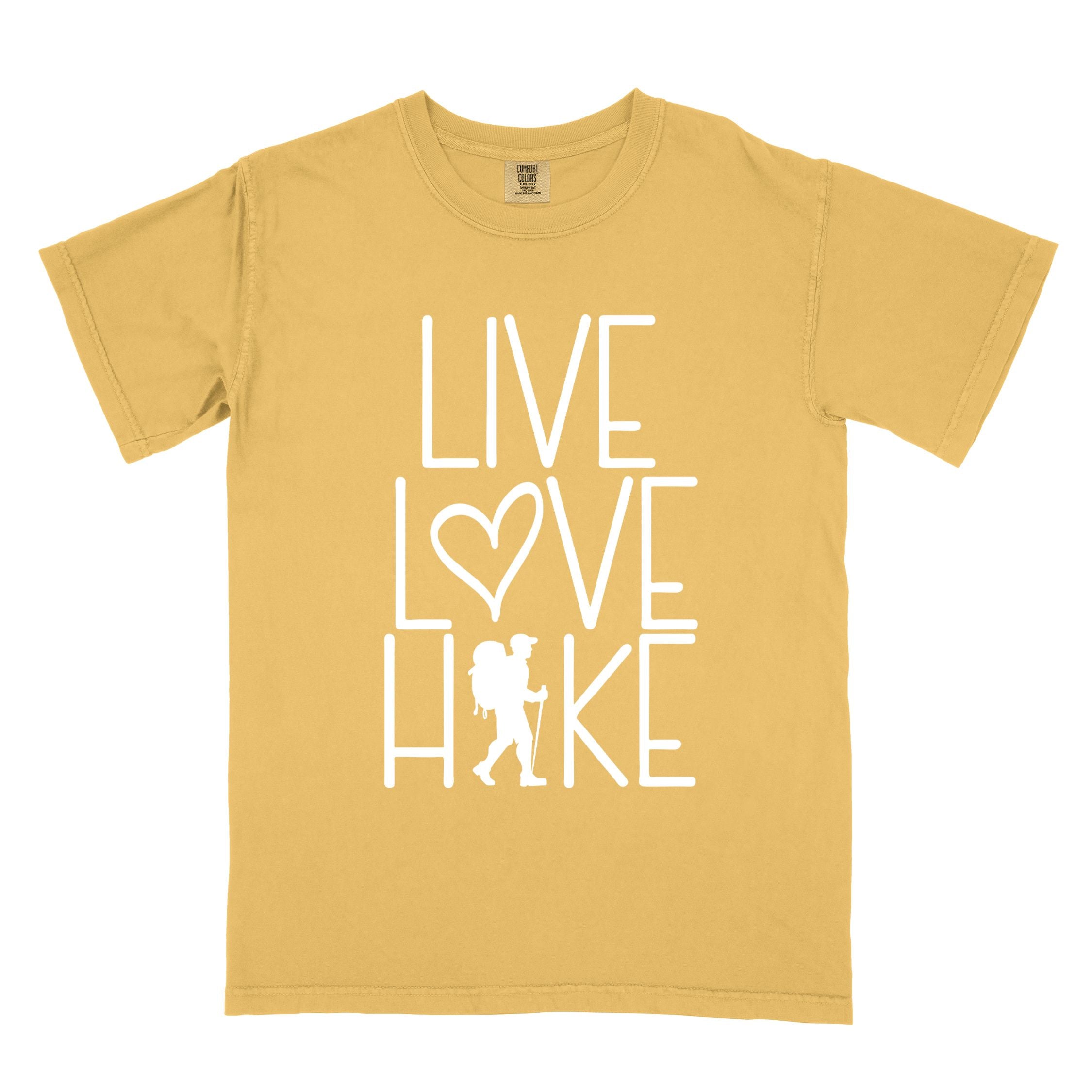 Mustard "Live Love hike" colored statement tee with bold typography, perfect for adventure motivated individuals.