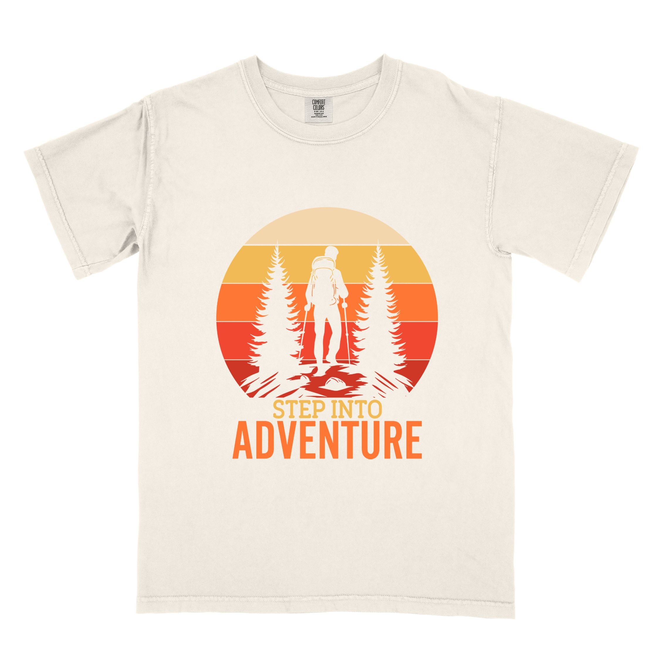 Ivory "Step into adventure" colored statement tee with bold typography, mountain, sunrise, perfect for adventure motivated individuals.