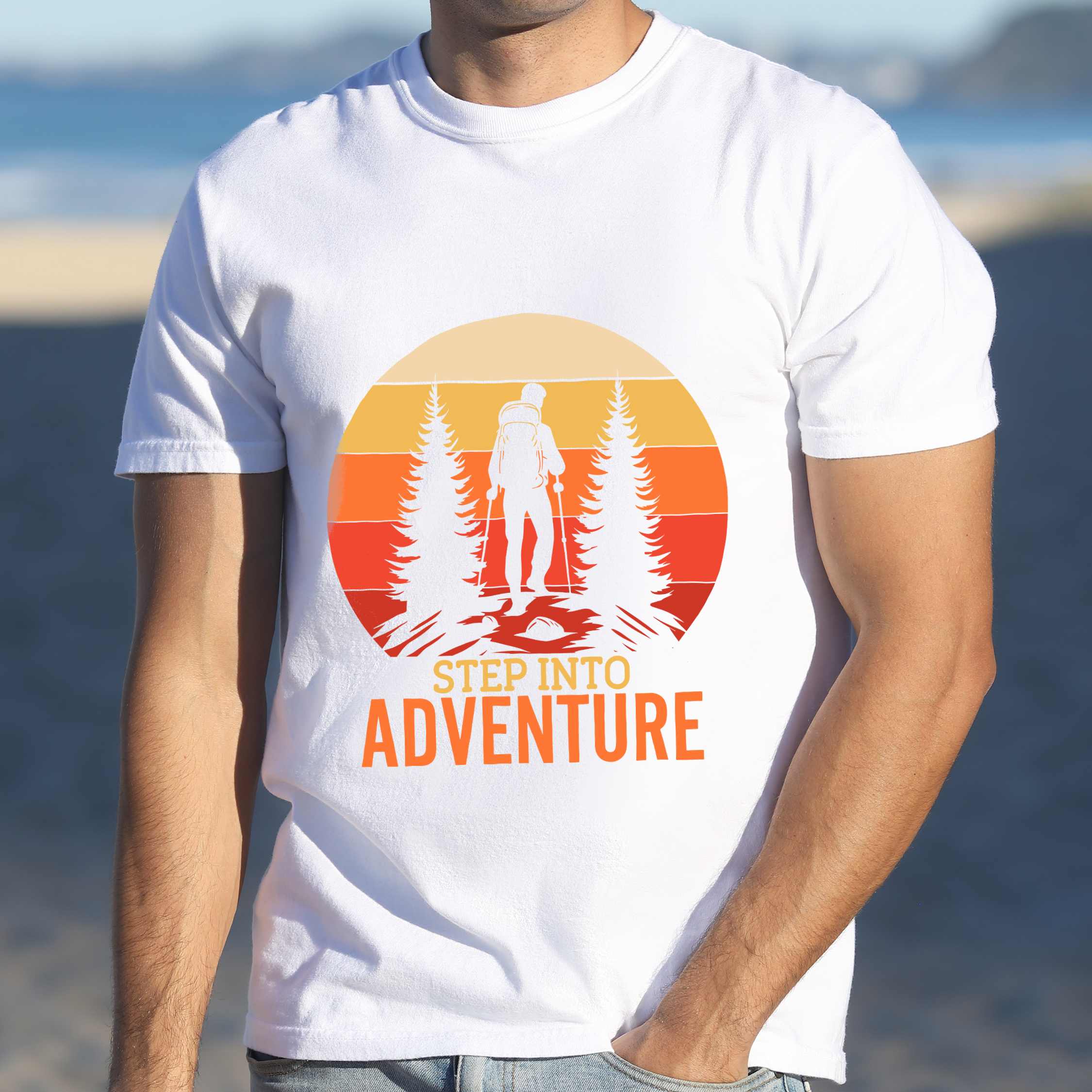 Man wearing white "Step into adventure" colored statement tee with bold typography, mountain, sunrise, perfect for adventure motivated individuals.