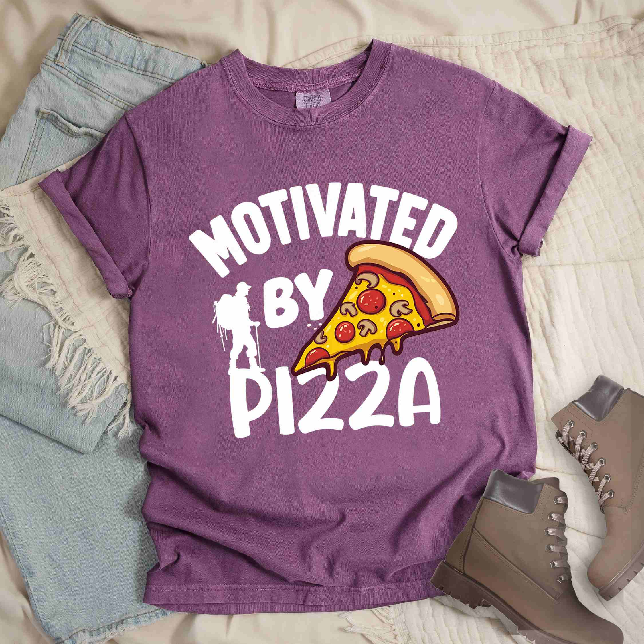 Berry Motivated by Pizza colored vintage tee with bold typography, illustrated pizza slice, and backpacker for foodies.