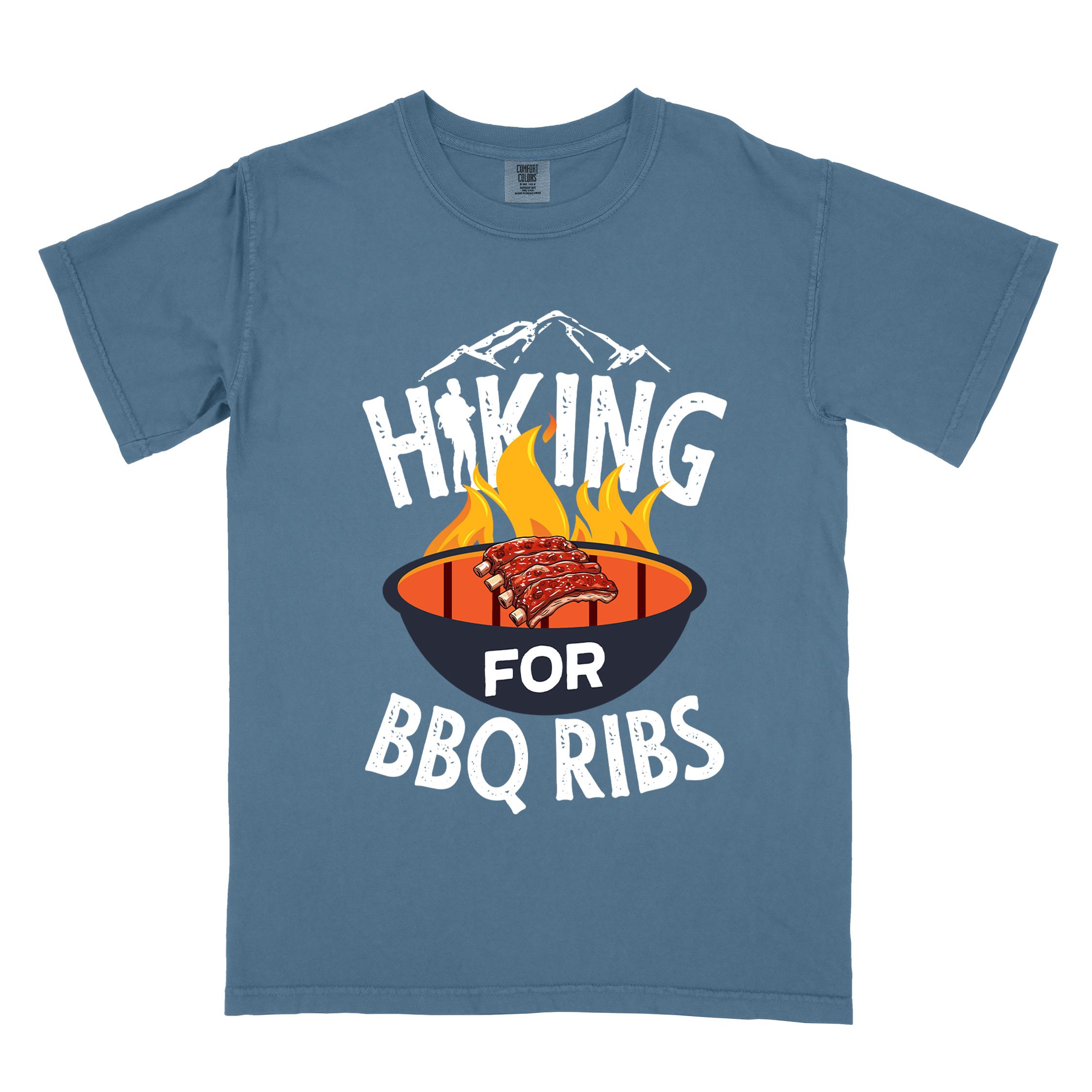 Blue jean Hiking for BBQ ribs colored vintage tee with bold typography, illustrated grilling bbq ribs, mountains, birds, and bbq enthusiasts