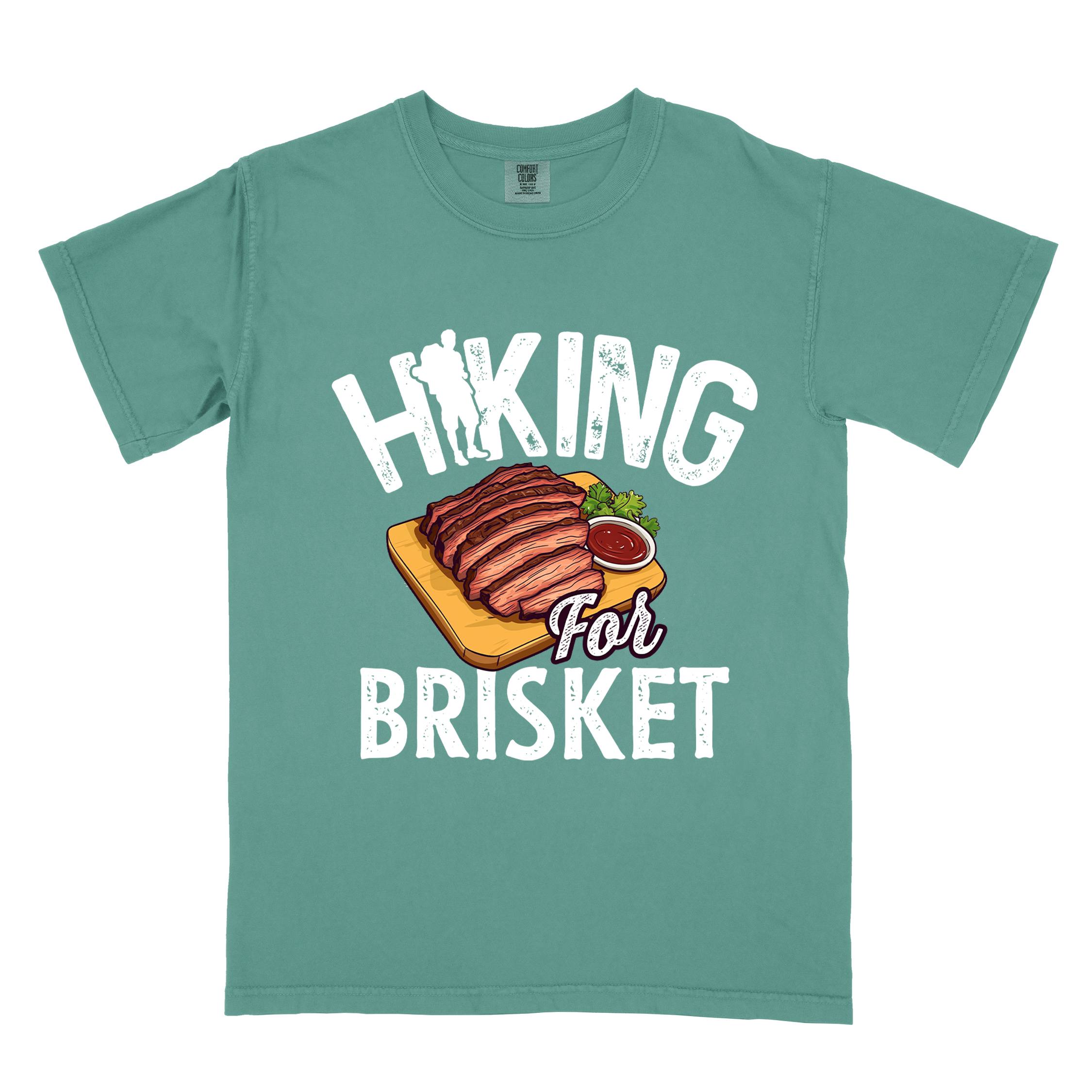 Light green Hiking for brisket colored vintage tee with bold typography, illustrated sliced brisket, birds, and backpacker for brisket lovers