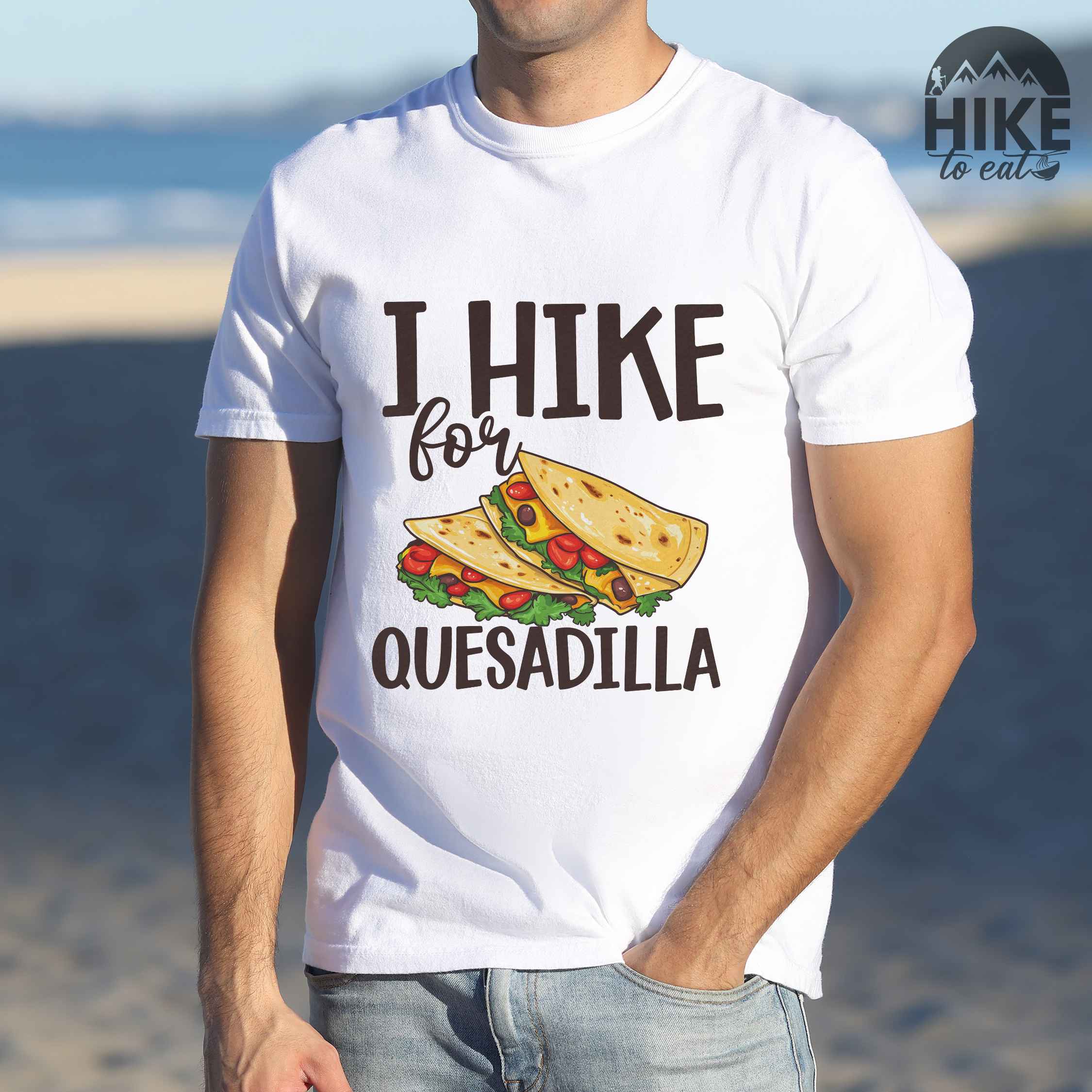 Man wearing white I Hike for Quesadilla colored vintage tee with bold typography, illustrated quesadilla wrap for backpackers with the craving for quesadillas