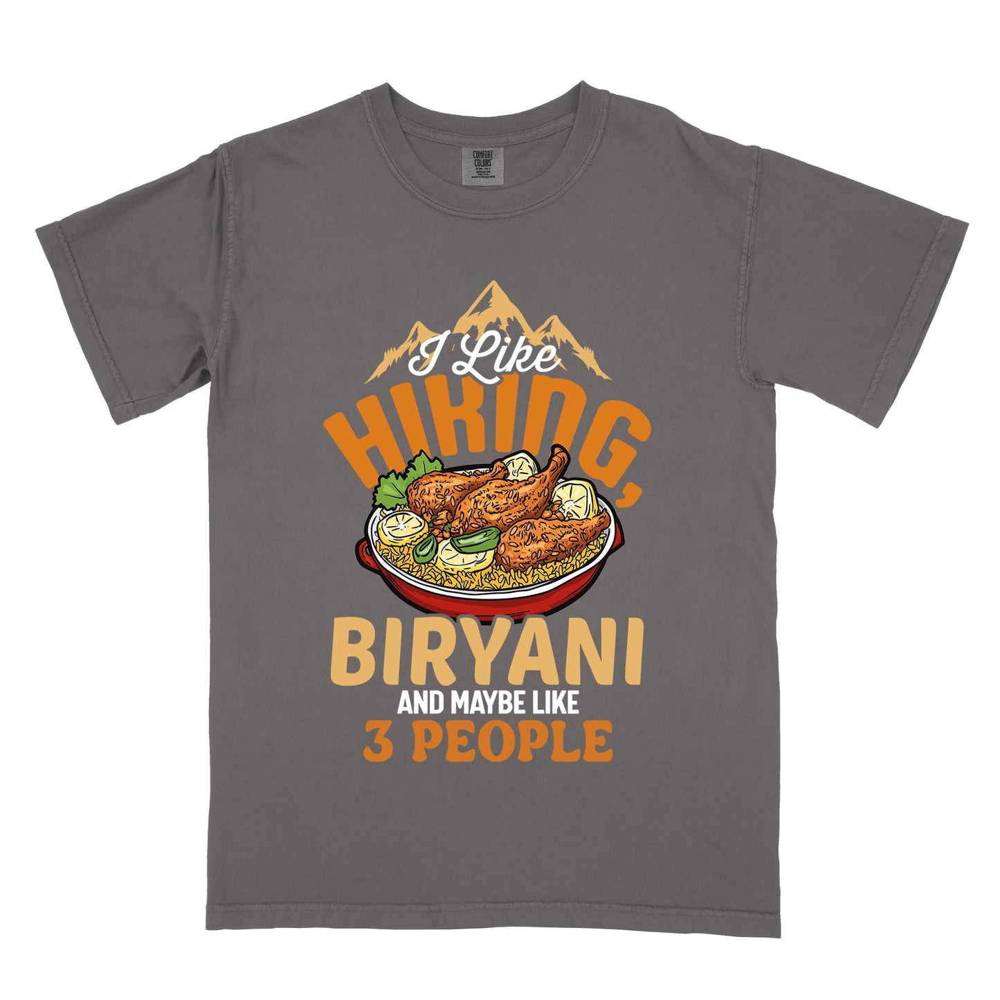 Pepper (Dark Gray) t-shirt with text reading "I Like HIKING, BIRYANI AND MAYBE LIKE 3 PEOPLE". Gold mountain silhouettes appear above "I Like" (in white script). "HIKING" is in large orange letters, below which sits a detailed illustration of a red bowl filled with biryani rice and chicken. "BIRYANI" appears in gold letters, while "AND MAYBE LIKE" is in small white text and "3 PEOPLE" in orange.