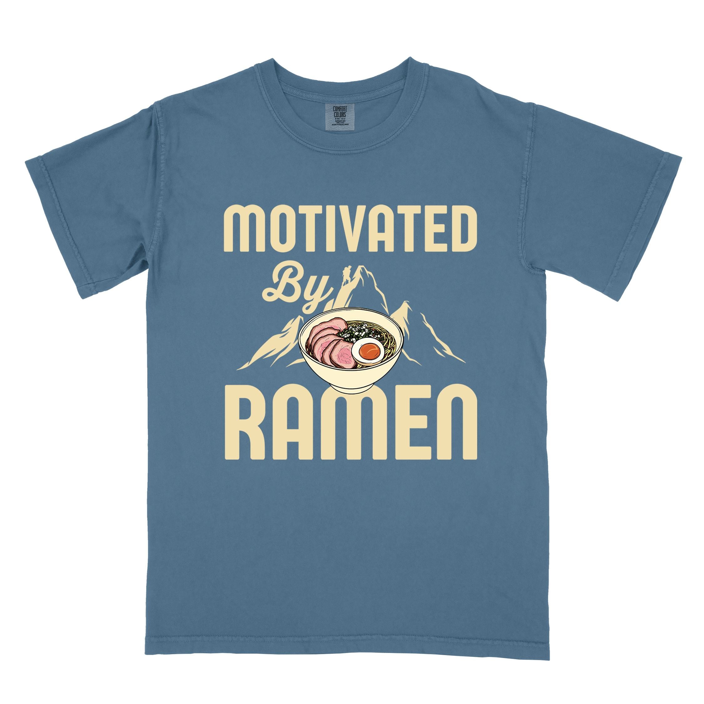 Blue jean “Motivated by Ramen” colored vintage tee with bold text, mountain, Illustration of hot ramen. Perfect tee for foodie craving for a bowl of ramen,