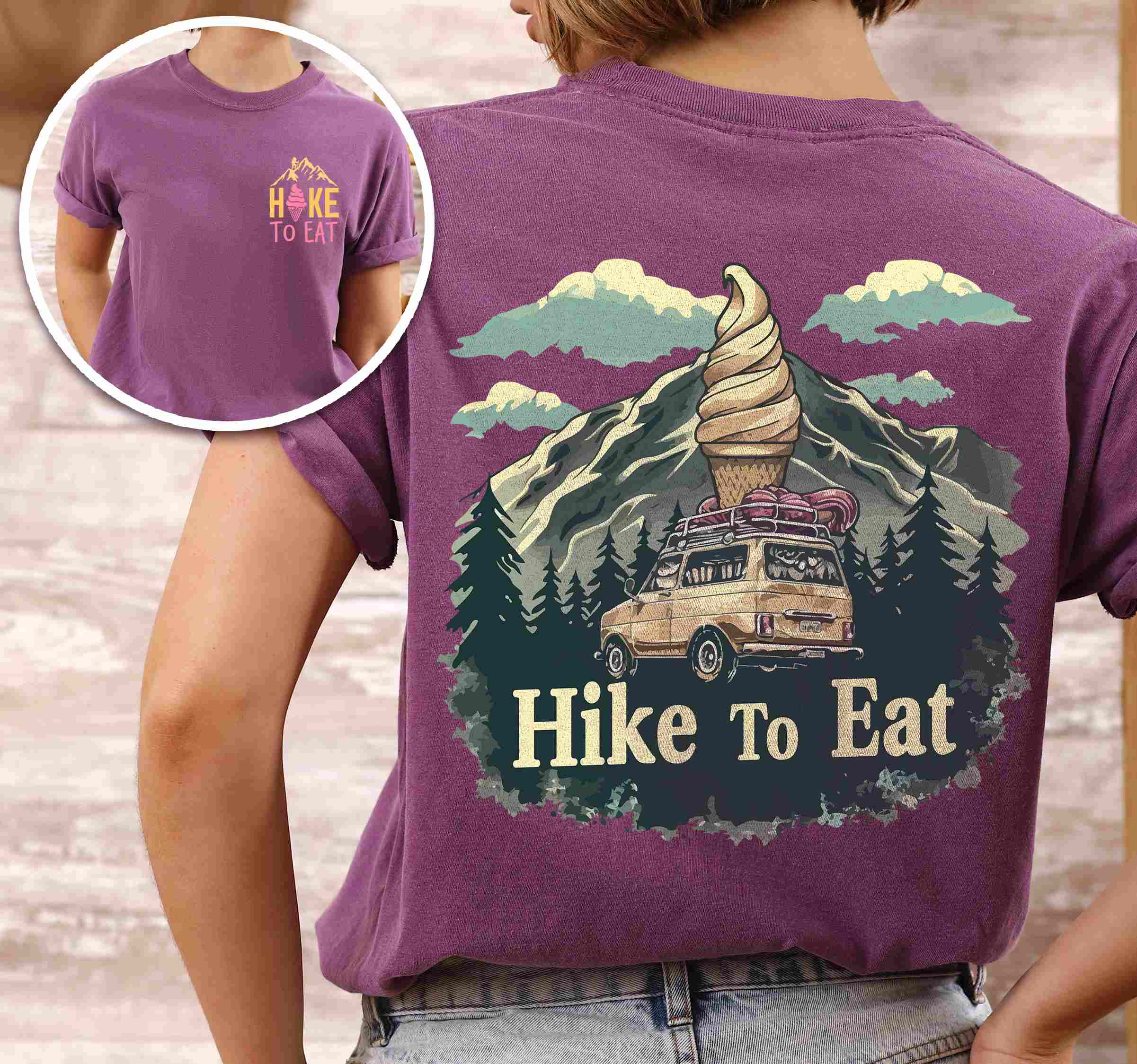 Woman wearing berry colored vintage tee with front and back design "Hike to Eat" text in cream lettering, mountains, birds, illustrated icecream cone, and backpacker for dessert lovers.