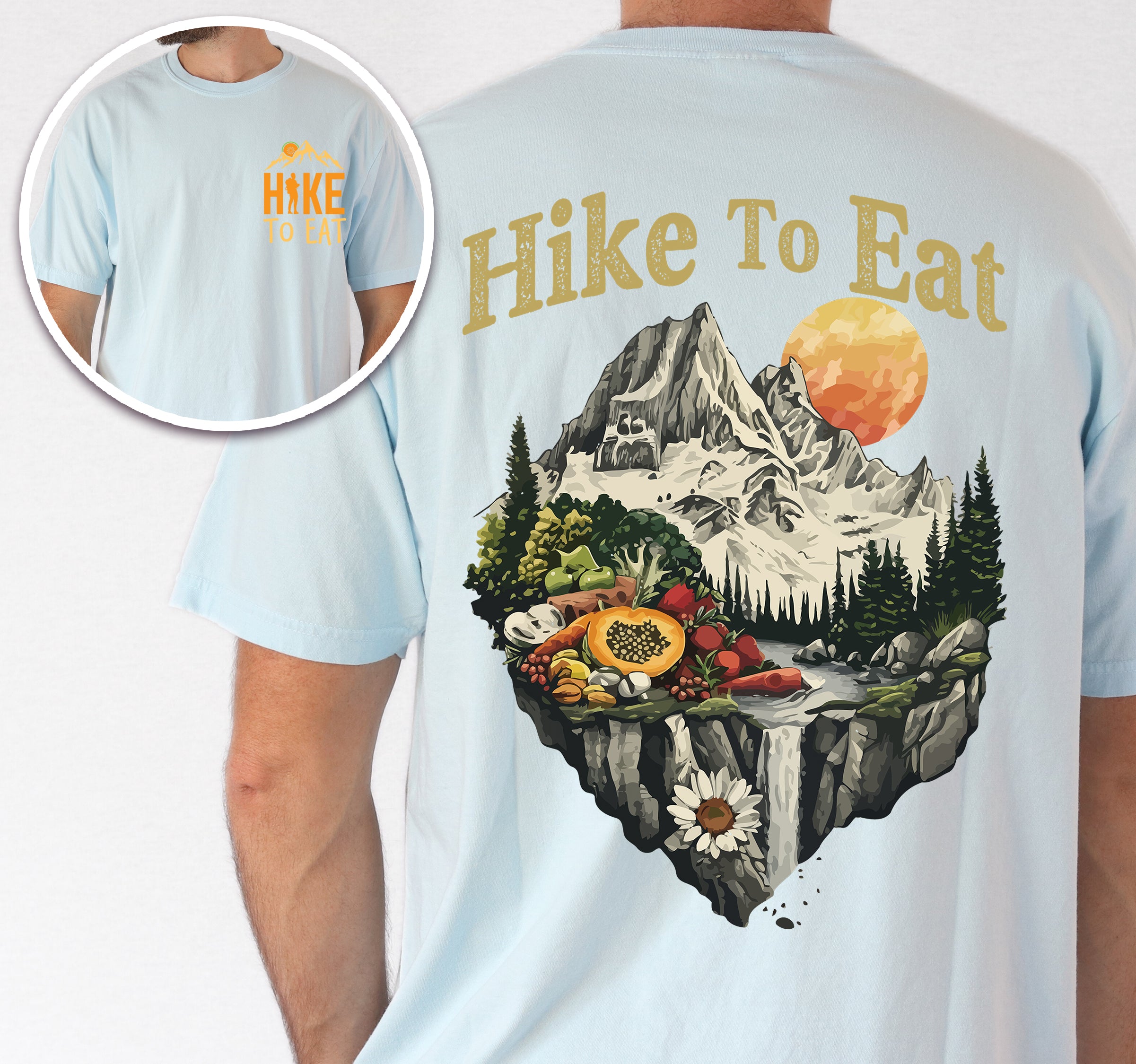 Chambray (Light Blue) Hike to Eat t-shirt front and back view showing small chest logo and large back design featuring mountain landscape with waterfall and fresh food display including fruits and vegetables