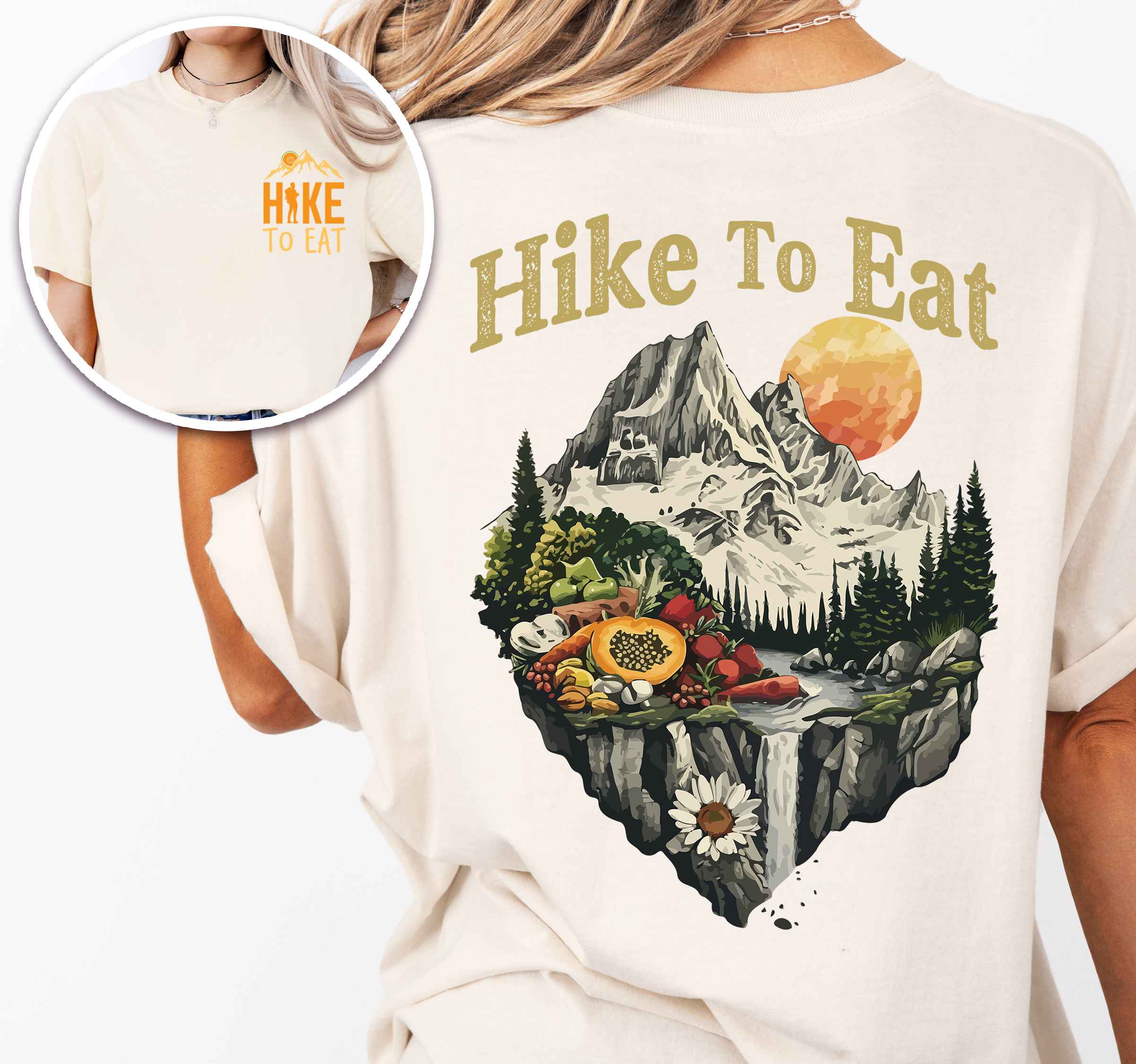Woman wearing ivory colored vintage tee with front and back design "Hike to Eat" text in cream lettering, mountains, birds, illustrated fruits, and backpacker for fruit lovers.