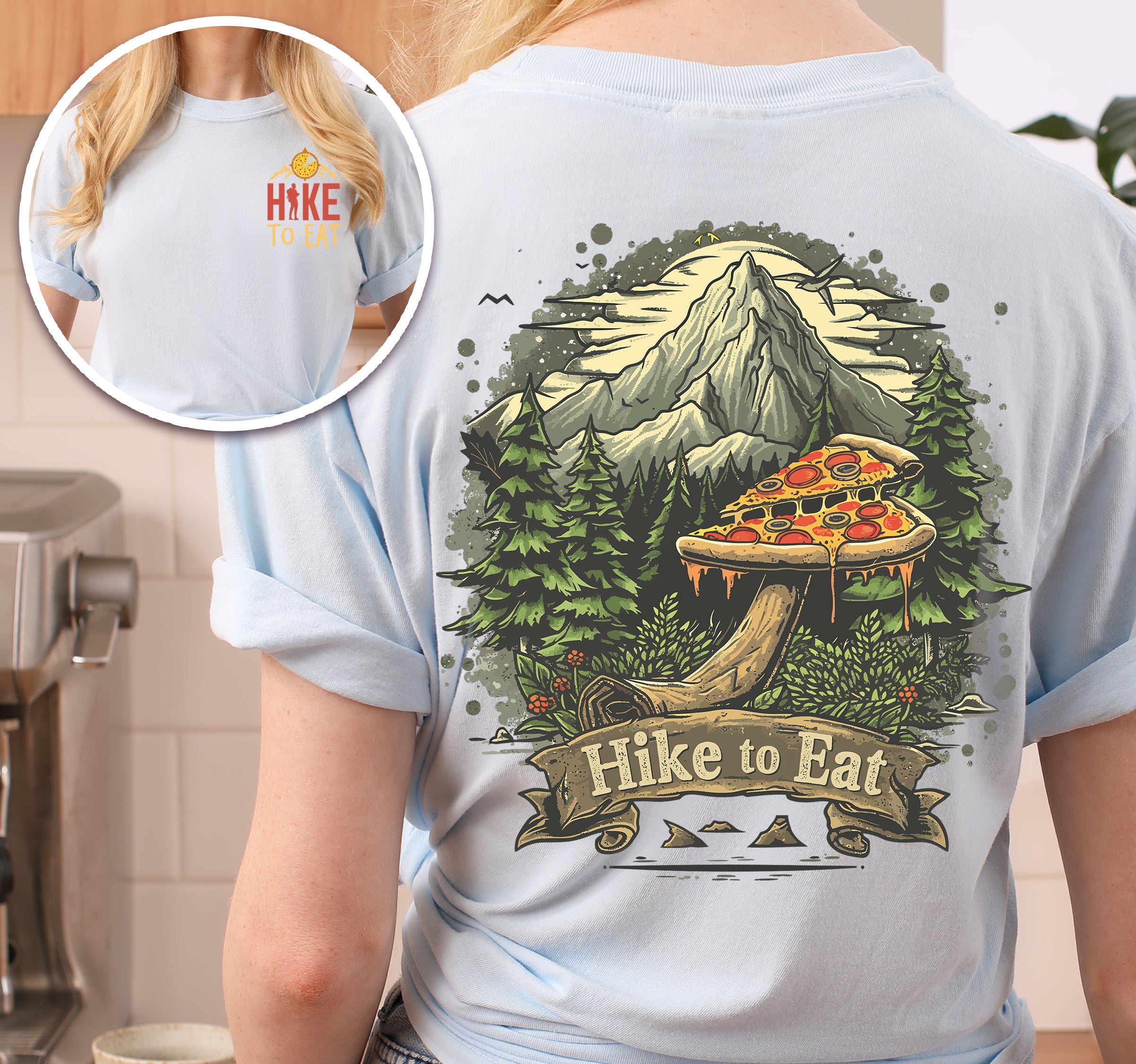 Chambray (Light Blue) Hike to Eat t-shirt front and back view showing small chest logo and large back design featuring pizza mushroom in mountain forest scene with banner text