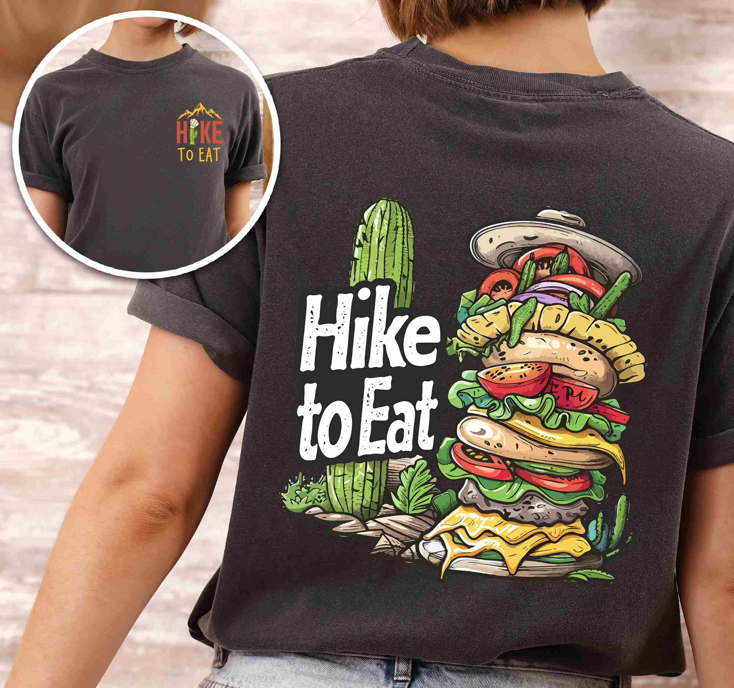 Woman wearing pepper "Hike to Eat" text in bold lettering front and back design, mountains, birds, illustrated stack of cheeseburger, and backpacker for burger lovers.