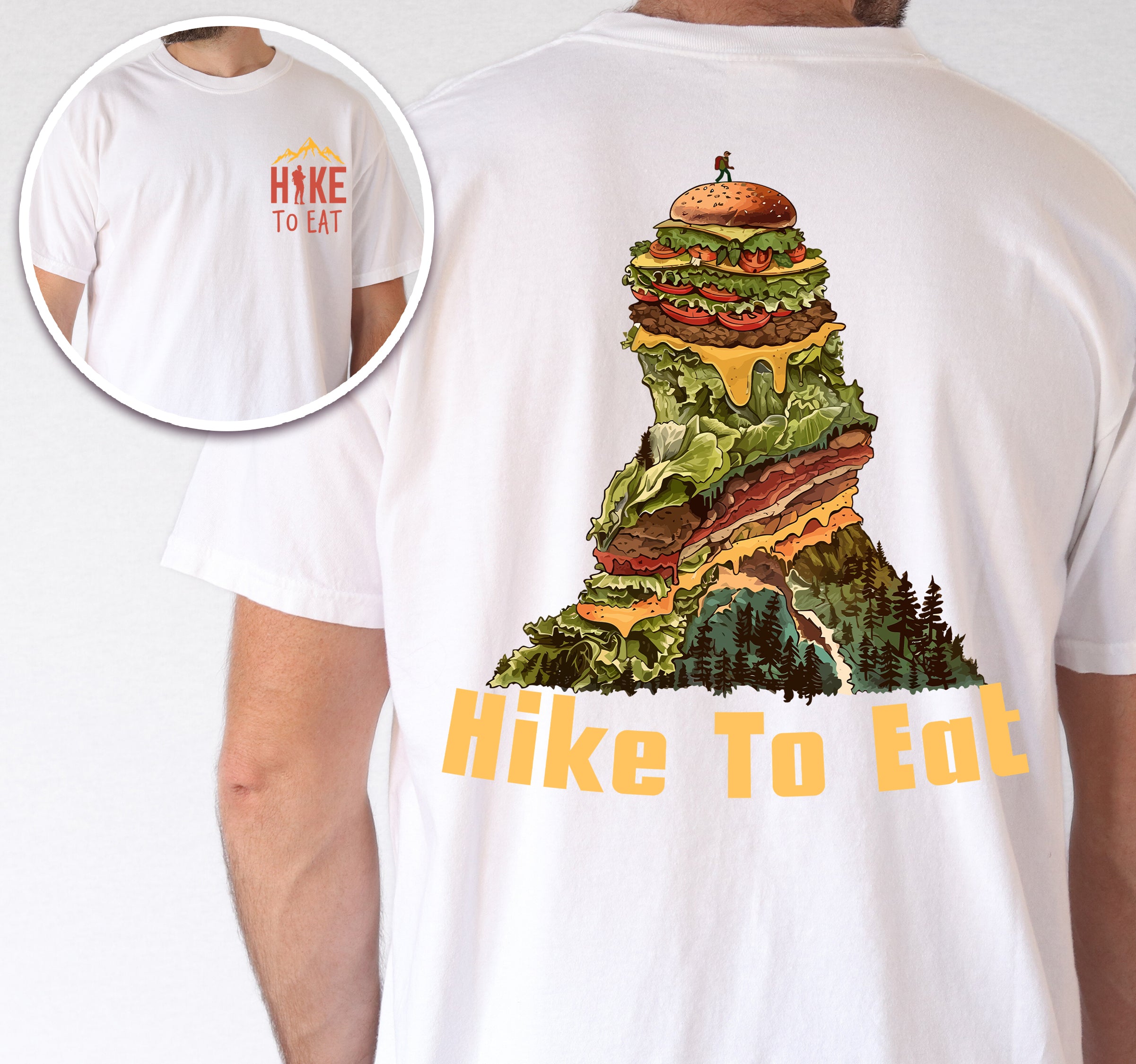 White Hike to Eat t-shirt front and back view showing small orange chest logo and large back design featuring mountain-shaped burger stack with multiple layers, lettuce, cheese, and pine forest at the base.