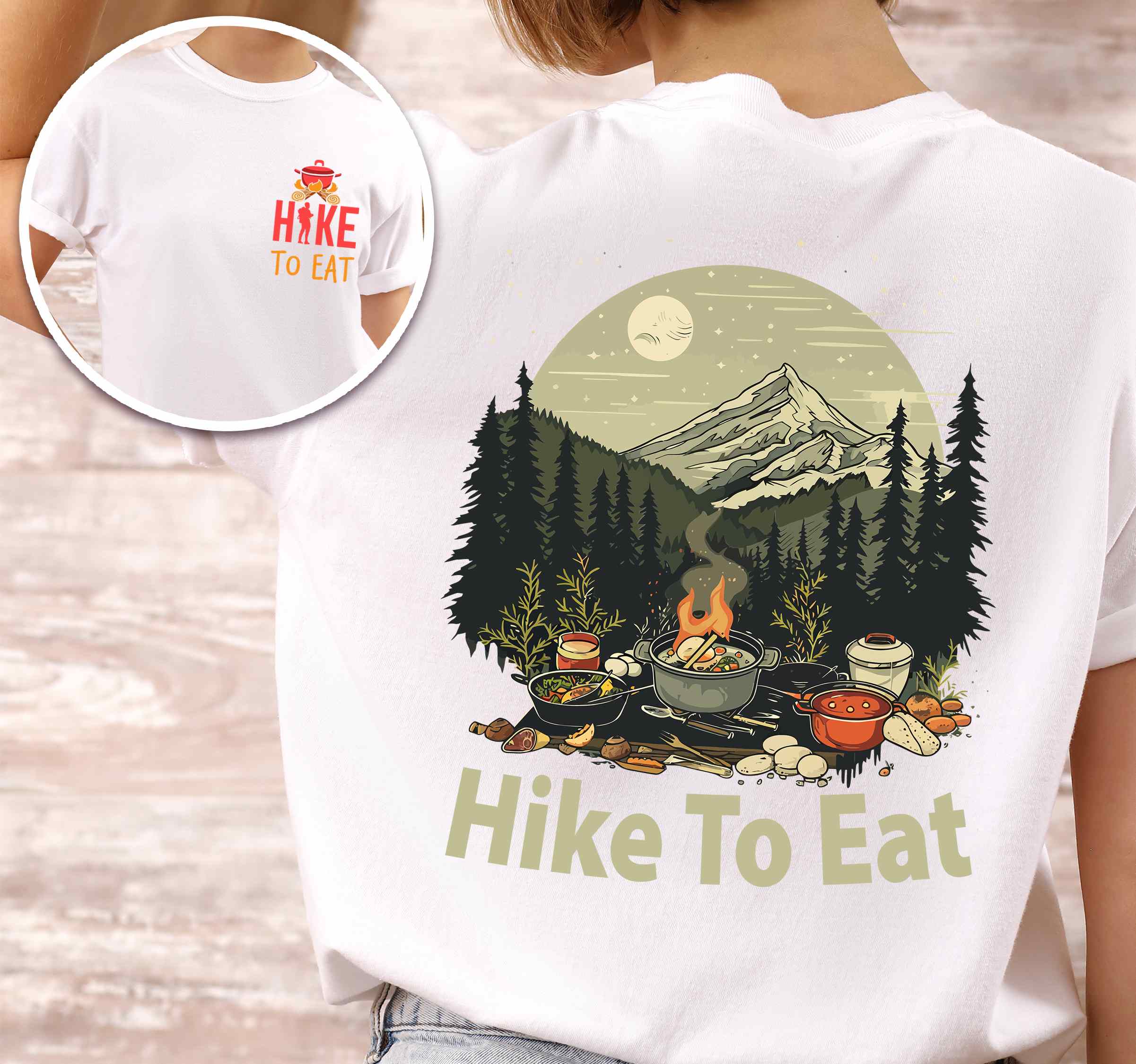 Woman wearing white "Hike to Eat" text in bold lettering front and back design, mountains, birds, illustrated camping feast, and backpacker for campfire cooking enthusiasts.