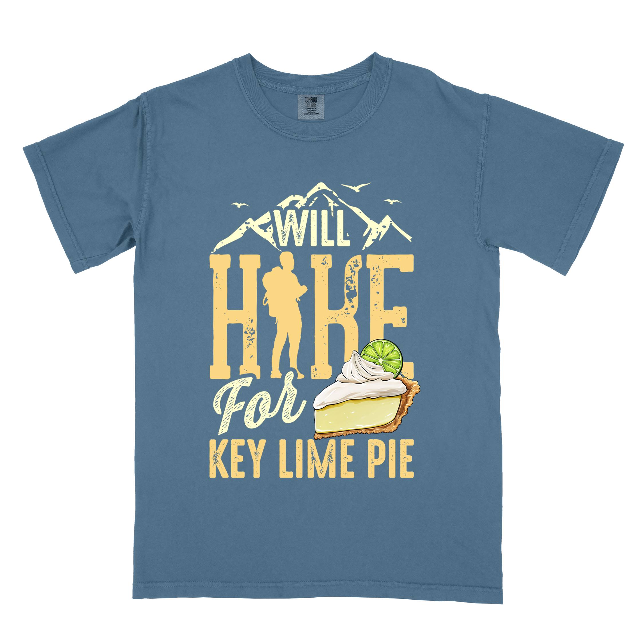 Blue jean "Will Hike for Key Lime Pie" colored vintage tee with bold typography, illustrated slice of key lime pie, mountains, birds, and backpacker with the sweet tooth.