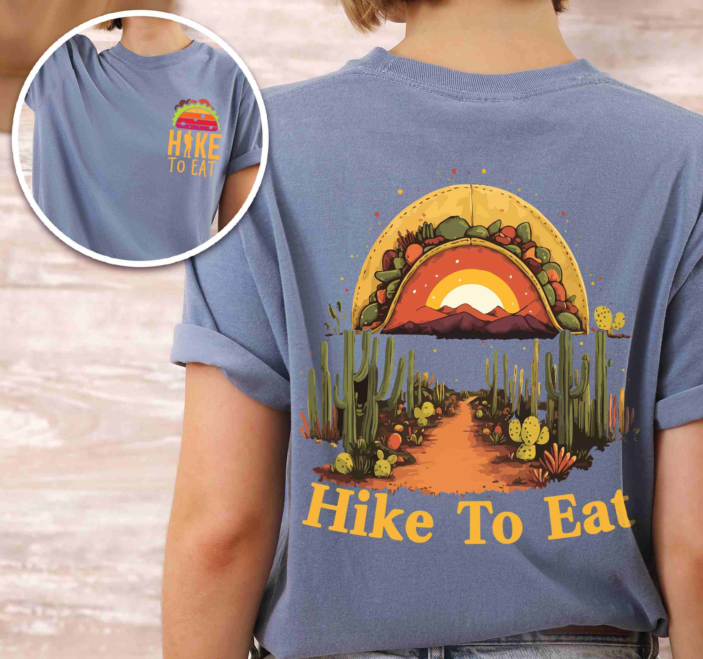 Woman wearing blue jean "Hike to Eat" text in bold lettering back design, mountains, birds, illustrated sunset taco, and backpacker for taco enthusiasts.