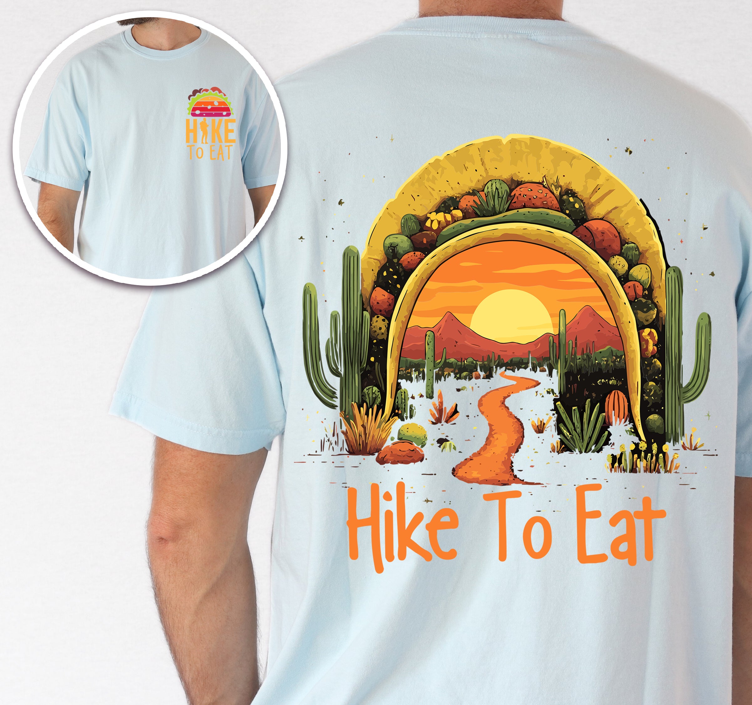 Chambray (Light Blue) Hike to Eat t-shirt front and back view showing small colorful taco above chest logo and large back design featuring taco shell silhouette filled with orange sunset over desert landscape, winding hiking trail, tall saguaro cacti, desert plants, and starry night sky.