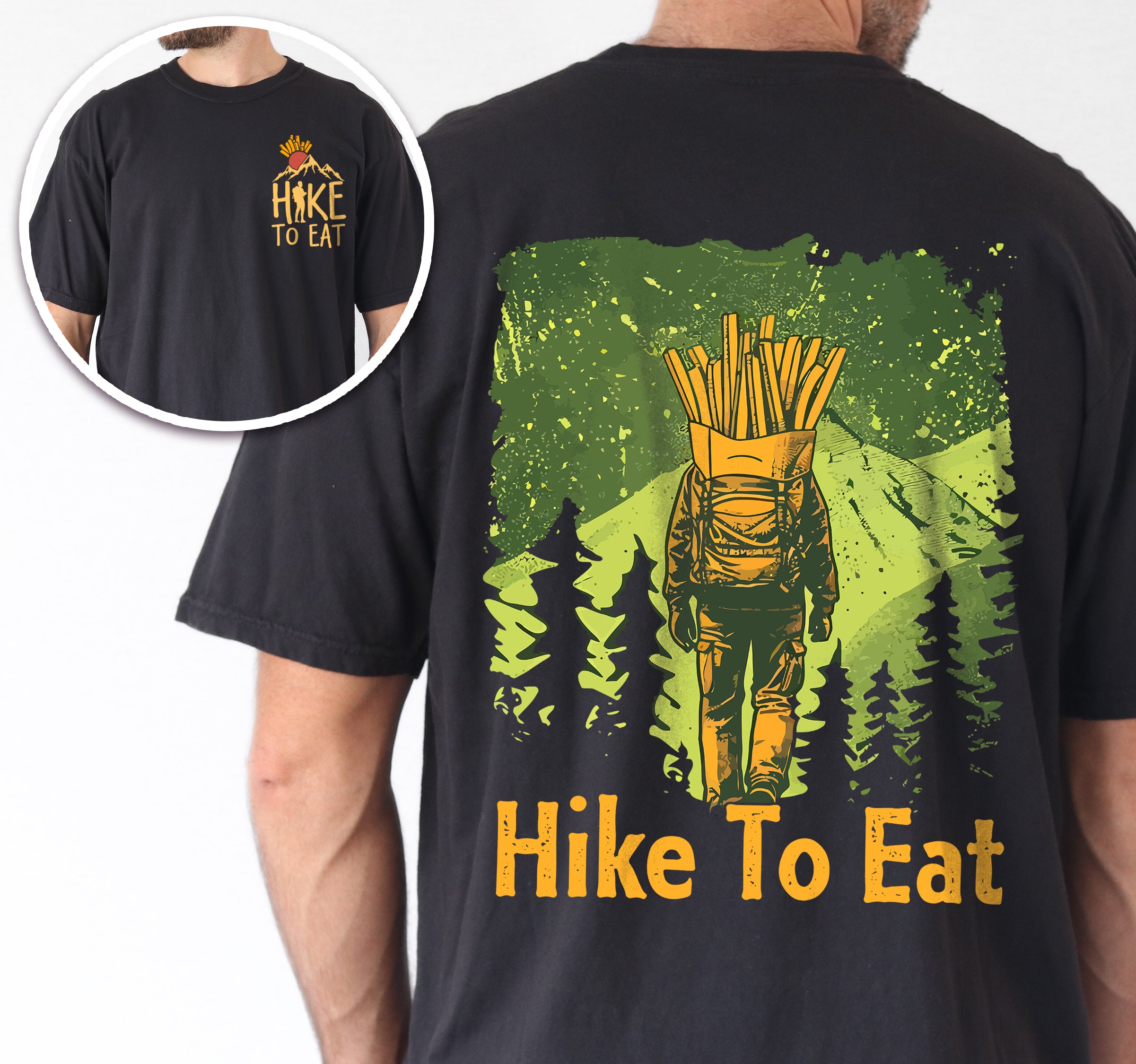 Black Hike to Eat t-shirt front and back view showing small french fries chest detail and large back design featuring hiker with french fries backpack walking through green forest landscape with pine tree silhouettes worn by a man.