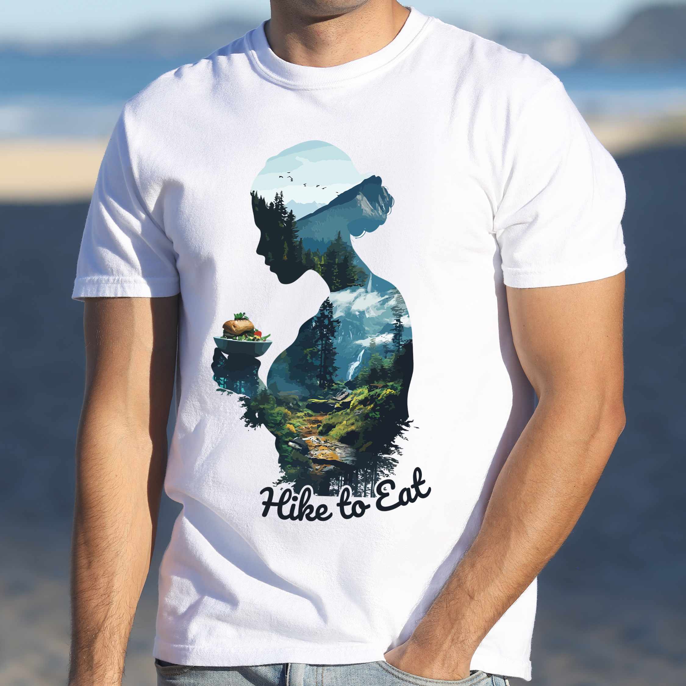 Man wearing white "Hike to Eat" colored vintage statement tee with text in cream lettering, mountains, birds, silhouette, illustrated sandwich, and backpacker for sandwich lovers.