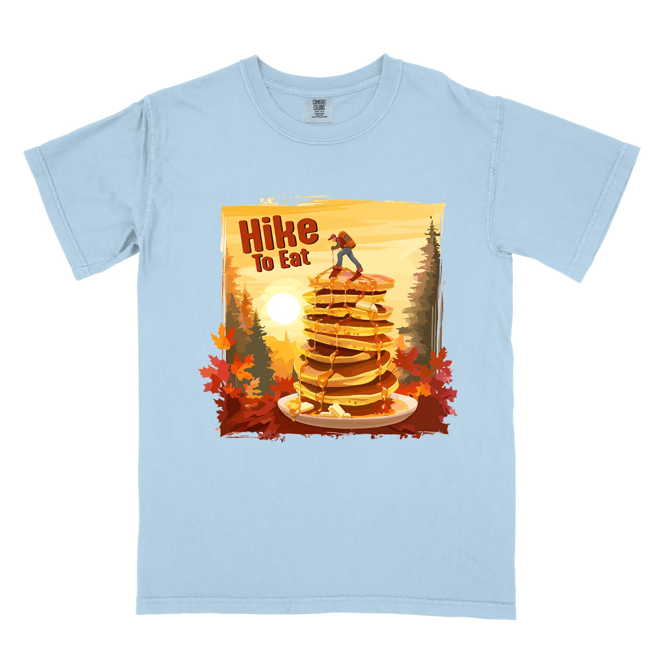 chambray "Hike to Eat" colored vintage statement tee with text in bold lettering, mountains, birds, silhouette, illustrated stack of pancake, and perfect for breakfast lovers.