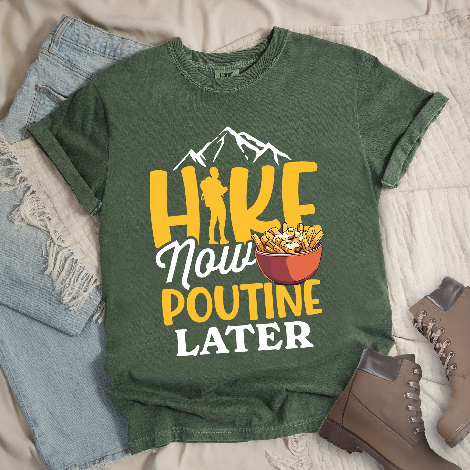 Dark green shirt with the text “Hike Now Poutine Later” featuring a hiker silhouette, mountain outline, and a bowl of poutine with fries, cheese curds, and gravy.