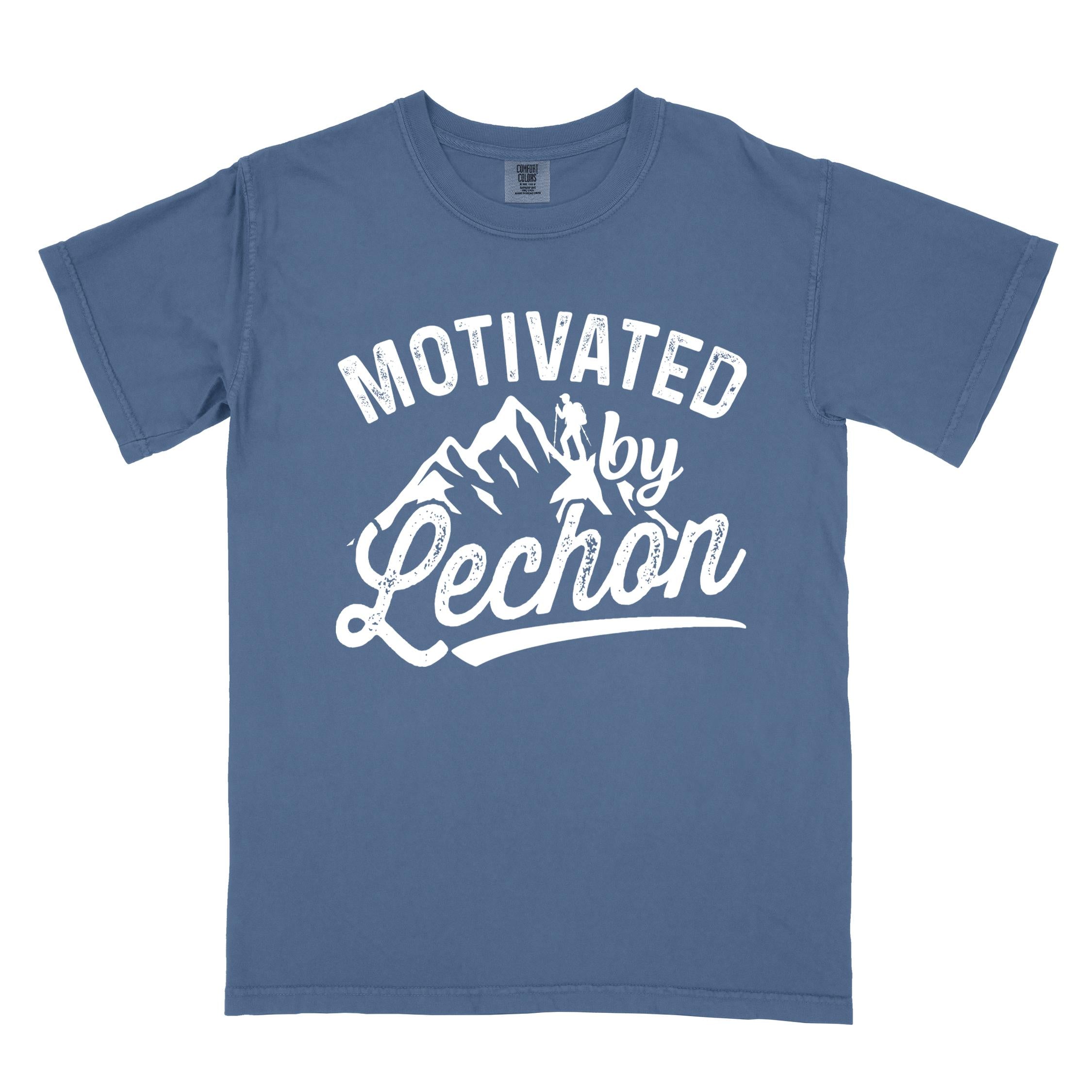 Blue jean colored graphic t-shirt with 'Motivated by Lechon' text in white lettering featuring mountain silhouettes and hiker illustration