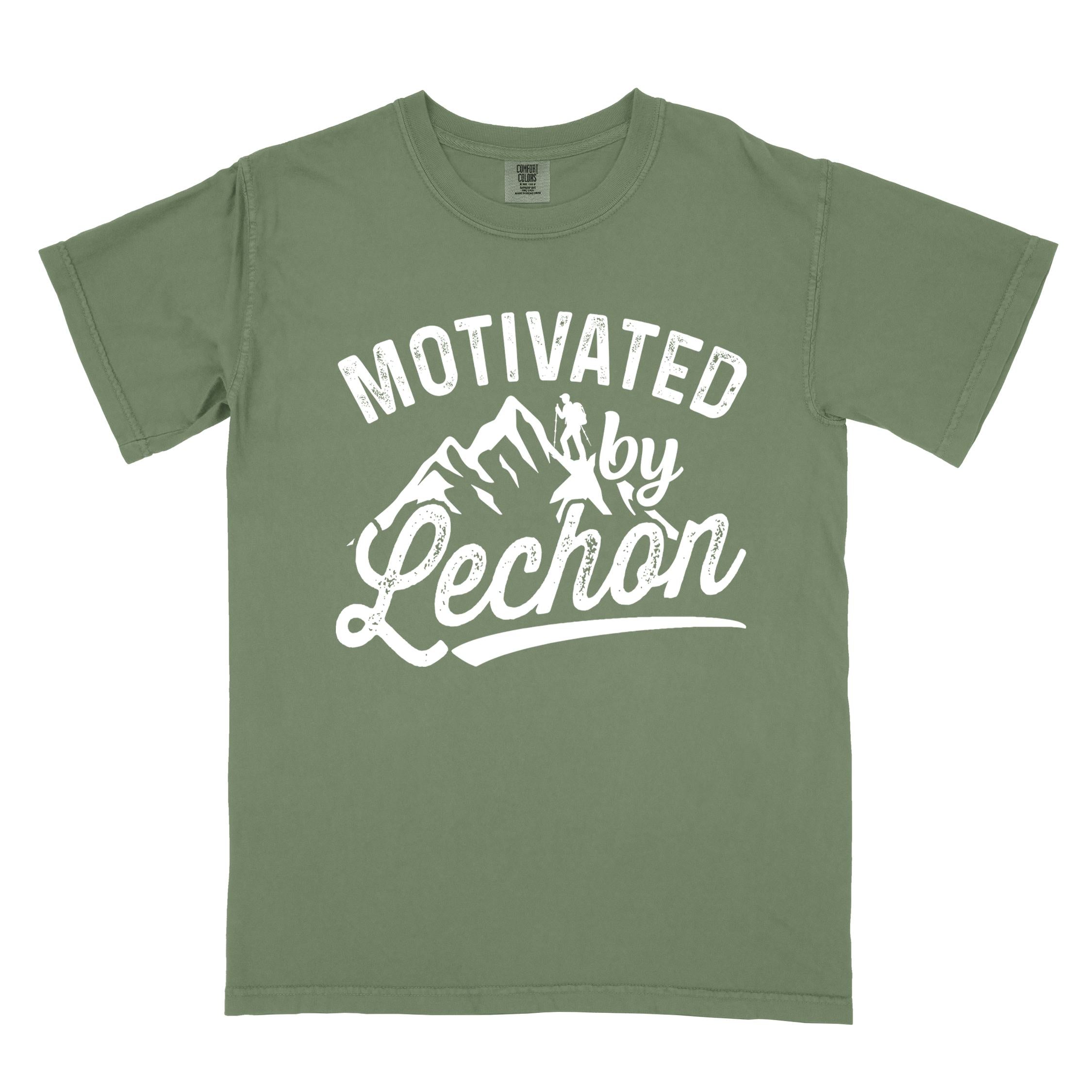 Moss colored graphic t-shirt with 'Motivated by Lechon' text in white lettering featuring mountain silhouettes and hiker illustration