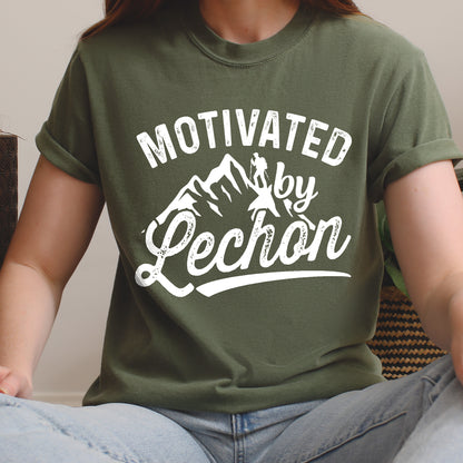 Moss (Dark Green) graphic t-shirt with 'Motivated by Lechon' text in white lettering featuring mountain silhouettes and hiker illustration