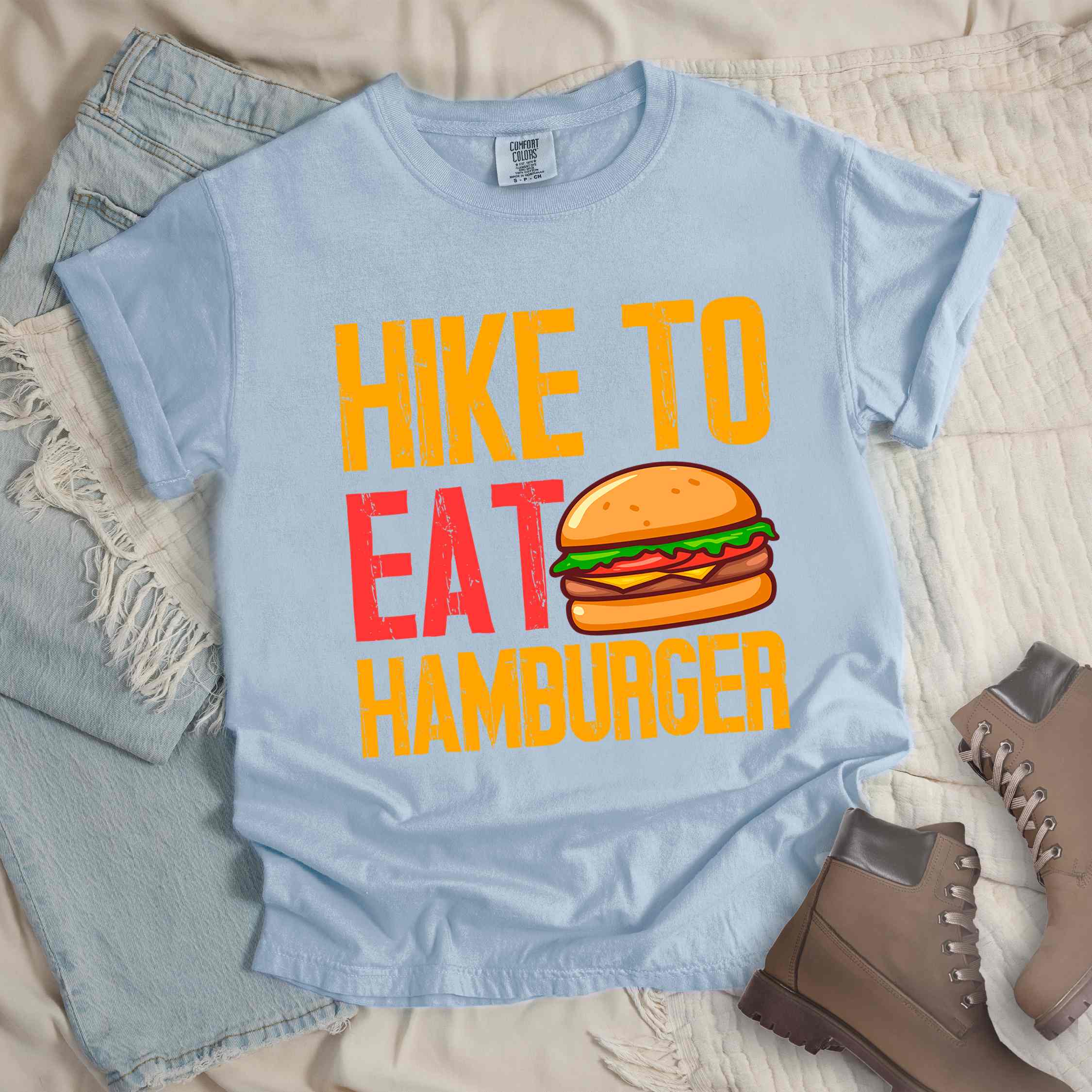 chambray "Hike to eat Hamburger" colored vintage tee with bold typography, juicy cheese hamburger illustration, perfect for the hamburger enthusiasts.