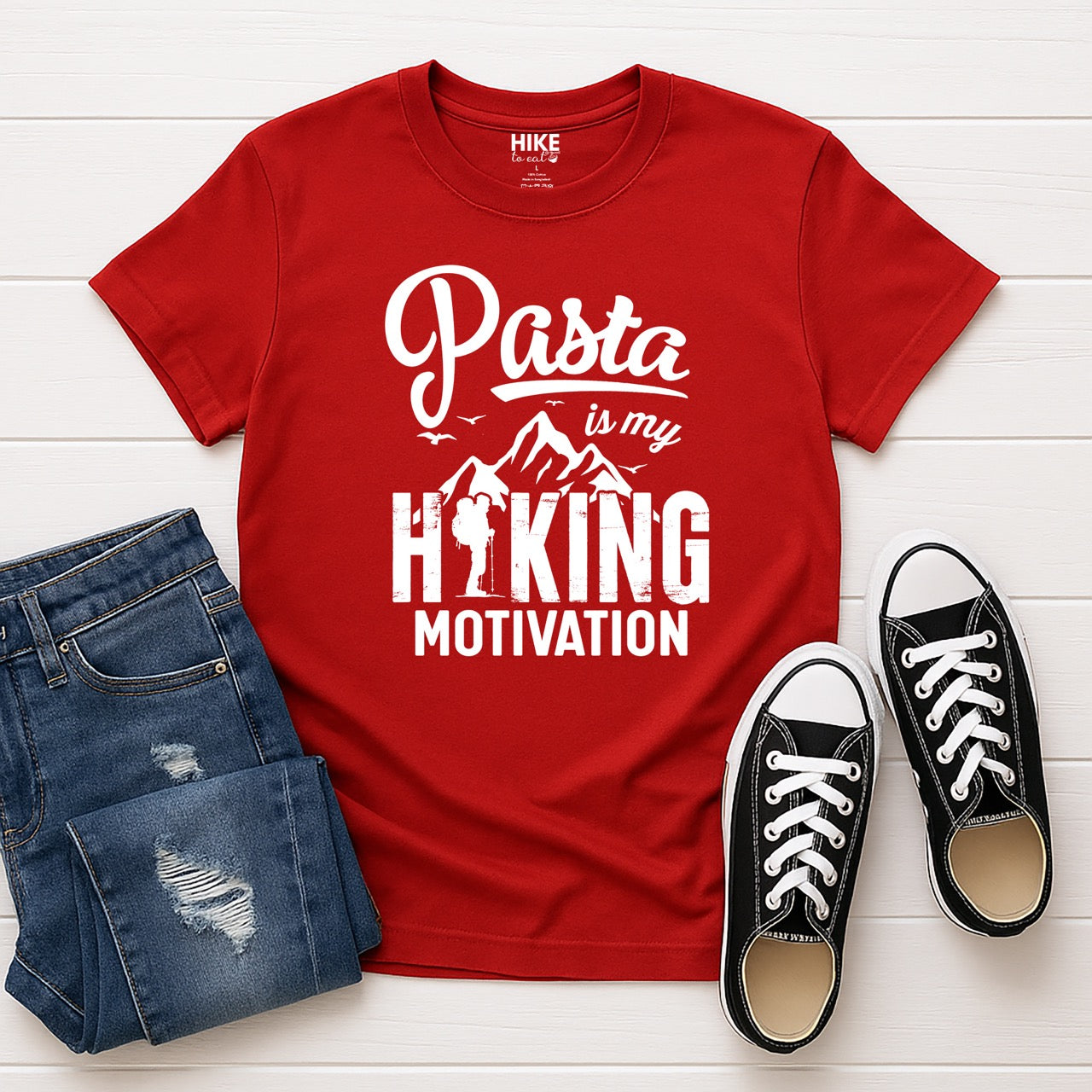 red Pasta is my Hiking Motivation statement tee with script typography, mountains, birds, and backpacker for pasta lovers with jeans and shoes