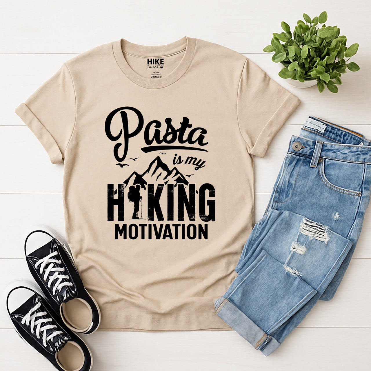 sand (beige) Pasta is my Hiking Motivation statement tee with script typography, mountains, birds, and backpacker for pasta lovers with jeans and shoes