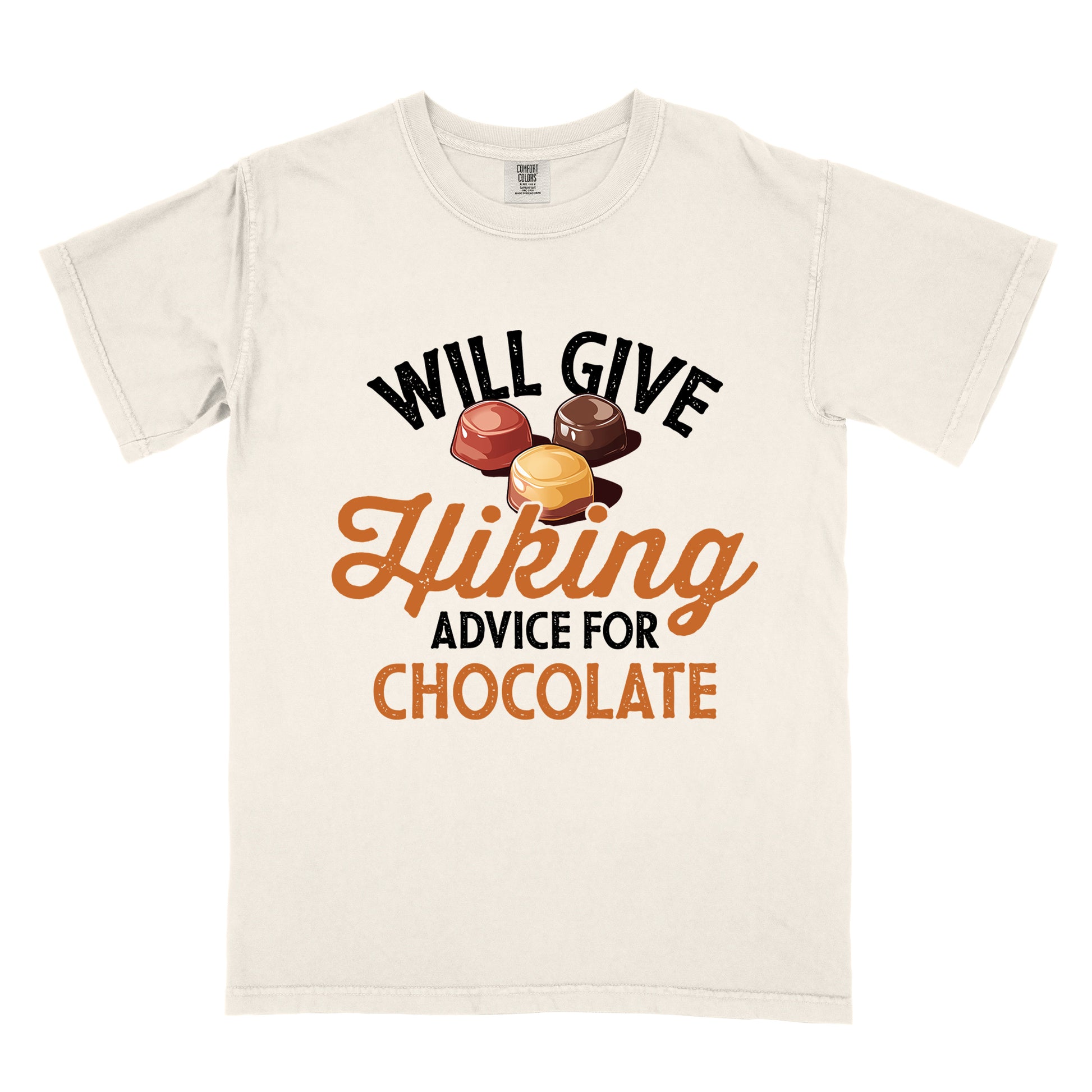 Ivory (Cream White) t-shirt with text reading "WILL GIVE Hiking ADVICE FOR CHOCOLATE". The words "WILL GIVE" appear in black distressed text at the top, "Hiking" in orange script in the middle, "ADVICE FOR" in black, and "CHOCOLATE" in orange at the bottom. Above the word "Hiking" is an illustration of three chocolate bonbons in different colors (dark, milk, and caramel).