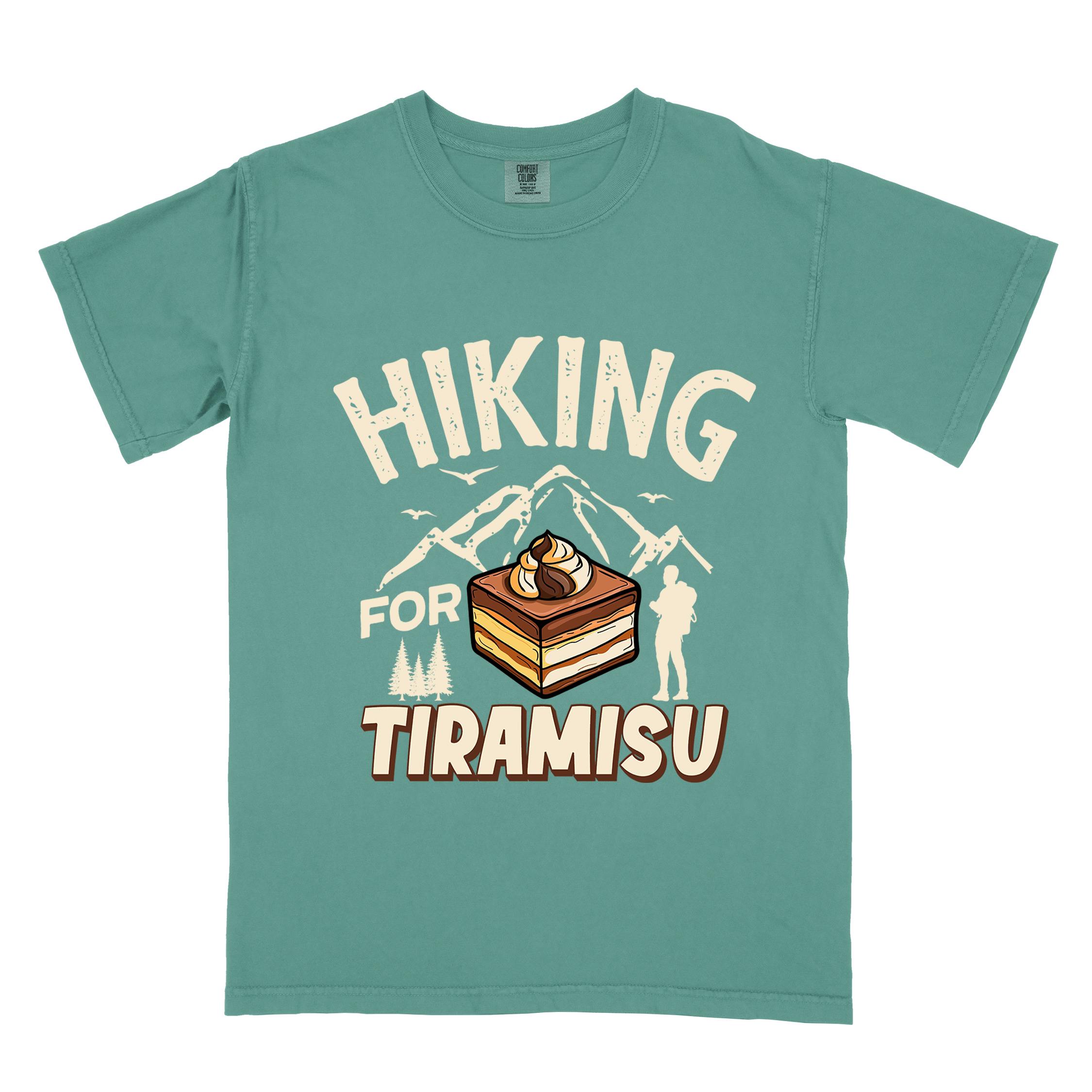 Light green "Hiking for Tiramisu" colored vintage tee with bold typography, mountains, illustrated a serving of Tiramisu, and backpackers with a sweet tooth.