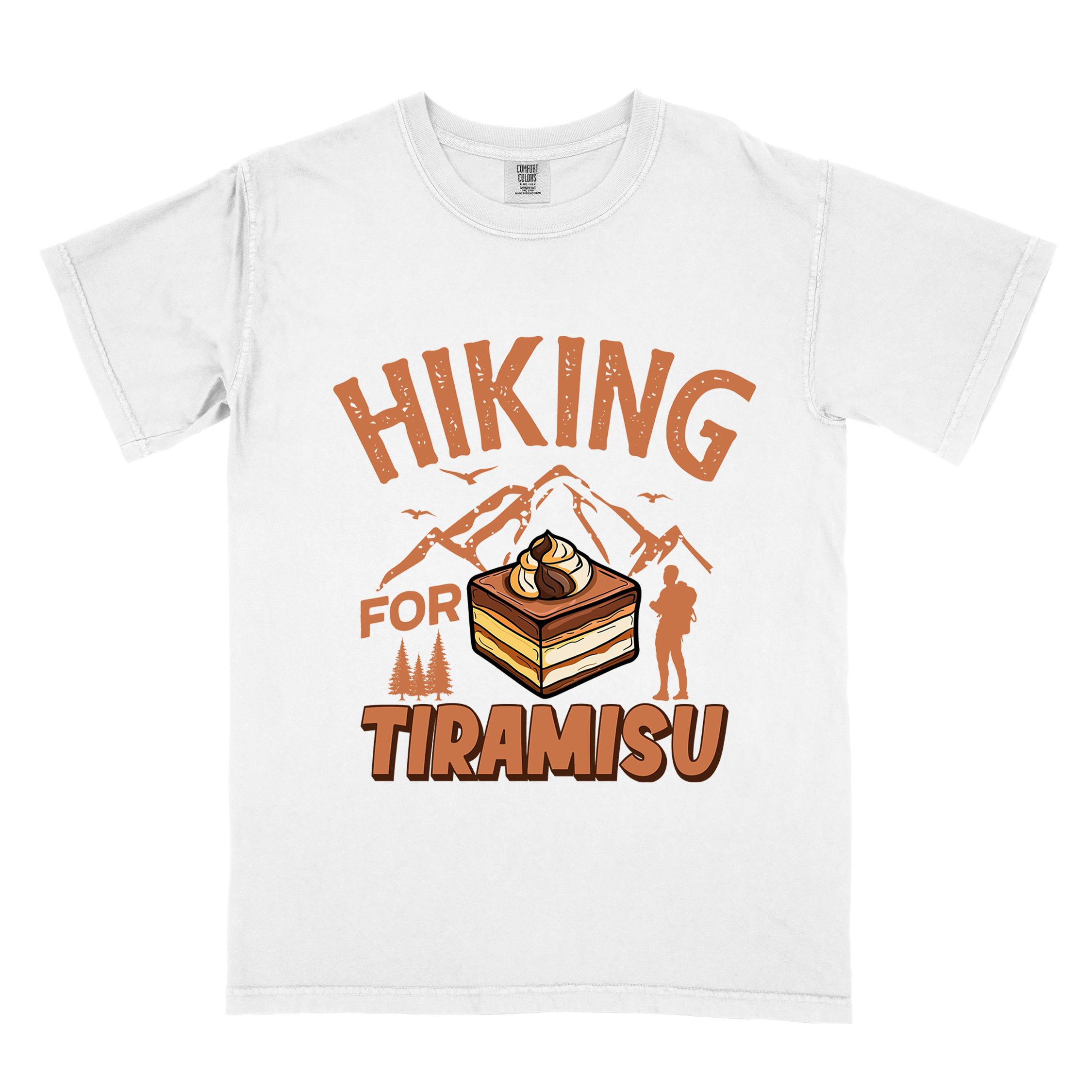 White "Hiking for Tiramisu" colored vintage tee with bold typography, mountains, illustrated a serving of Tiramisu, and backpackers with a sweet tooth.