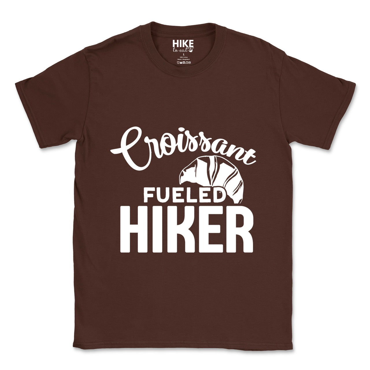 Chocolate brown Croissant Fueled Hiker statement tee with flowing script typography, bold lettering, and croissant illustration for French pastry-loving outdoor enthusiasts, hikers and foodies