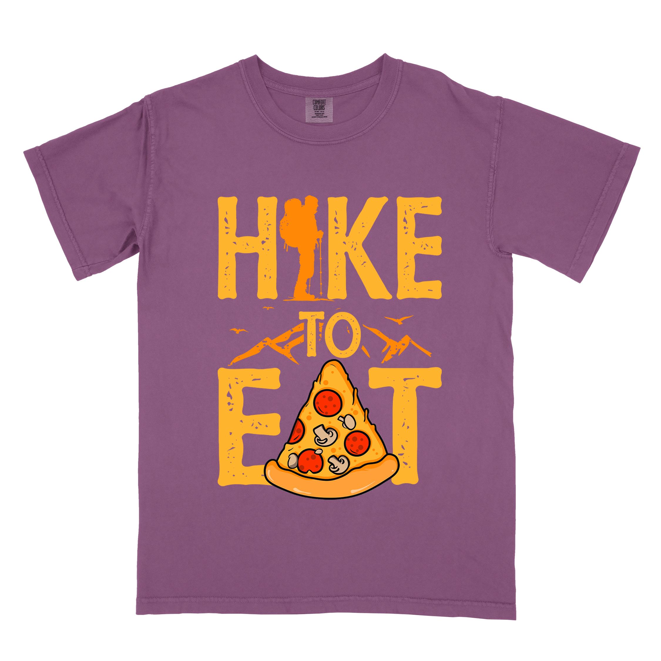 Purple "Hike to Eat" colored vintage tee with bold typography, birds, mountains, illustrated pizza slice, and backpacker for pizza lovers.