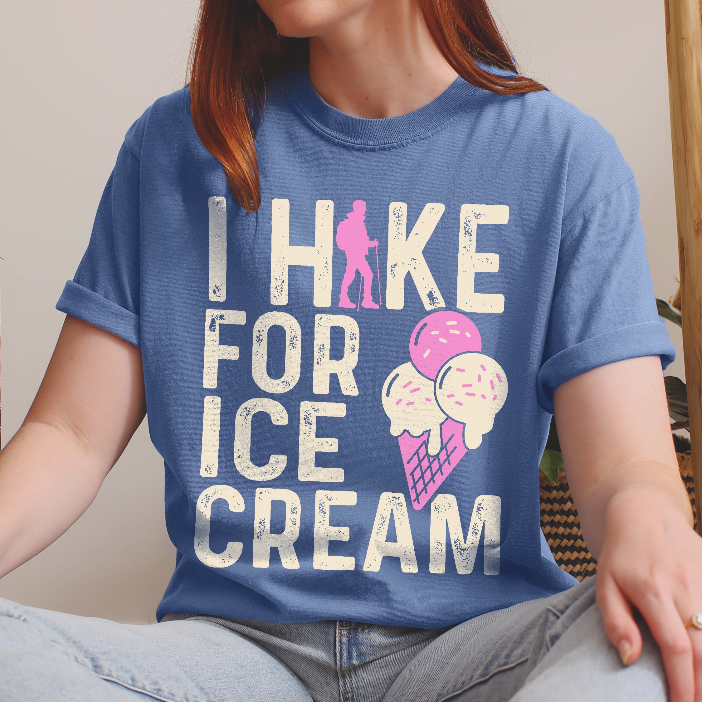 Blue Jean (Denim Blue) graphic t-shirt with 'I Hike for Ice Cream' text in cream lettering featuring pink hiker silhouette and colorful ice cream cone illustration with pink and cream scoops in purple waffle cone.