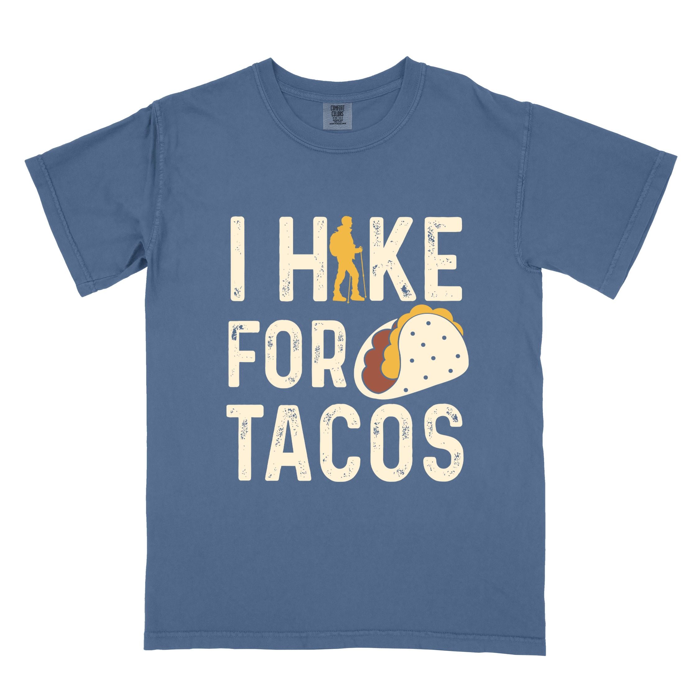 Blue jean colored vintage tee with 'I Hike for Tacos' text in cream lettering, illustrated taco, and backpacker for taco lovers