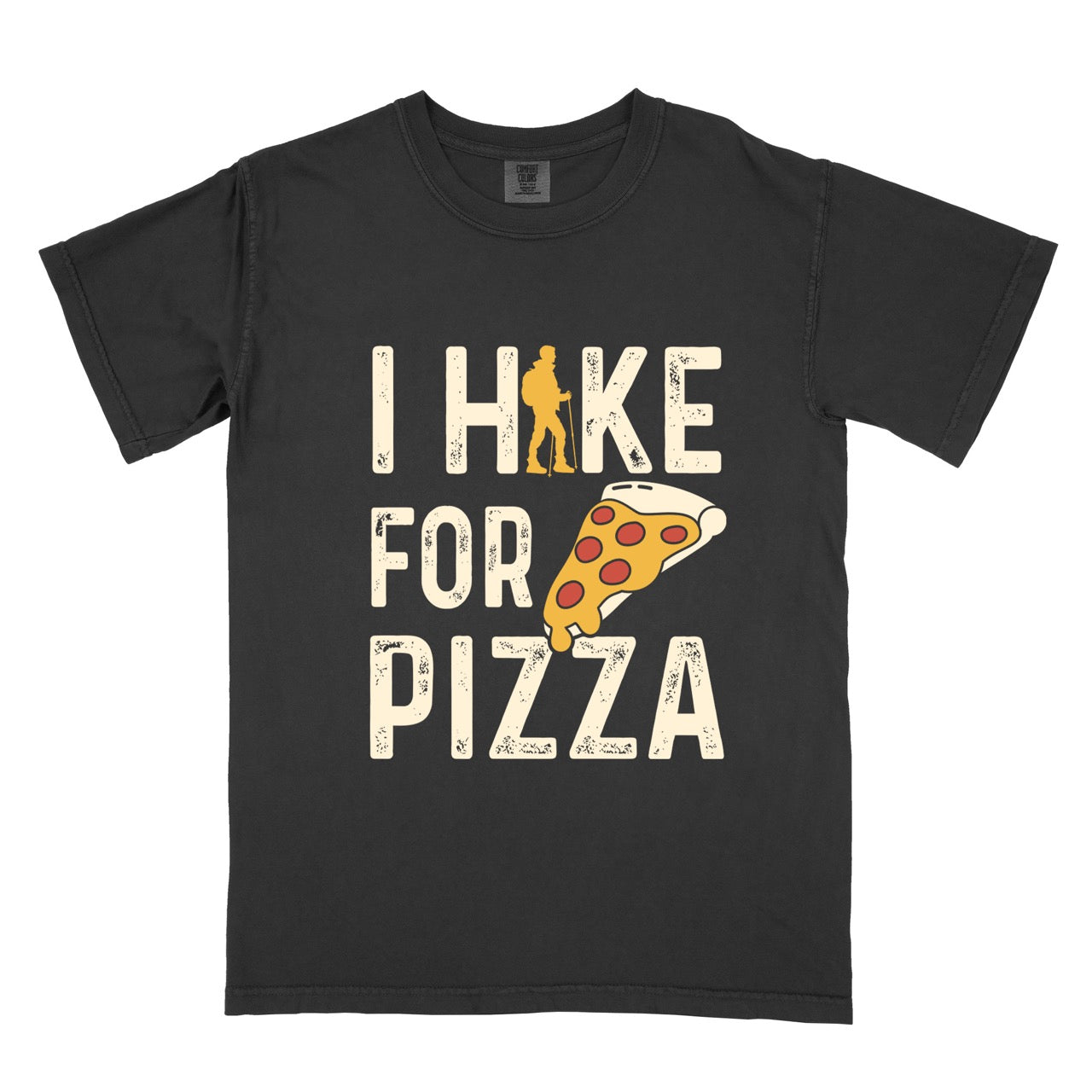  I Hike for Pizza graphic tee with distressed cream typography, pepperoni pizza slice illustration, and gold hiker silhouette on Comfort Colors shirt for Italian food enthusiasts and mountain trail lovers in black
