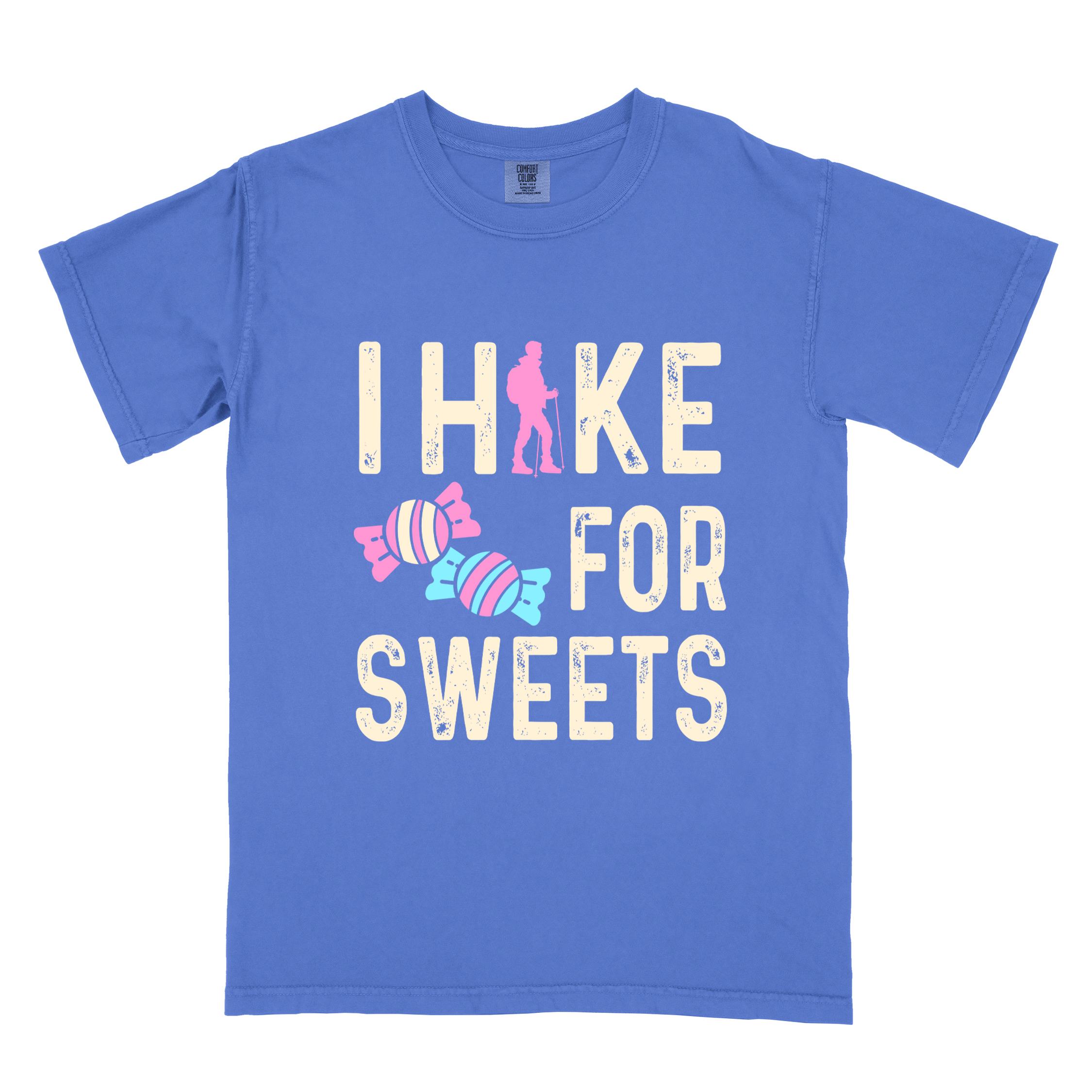 Flo blue 'I Hike for Sweets' text in cream lettering, illustrated pieces of candies, and backpacker for candy lovers