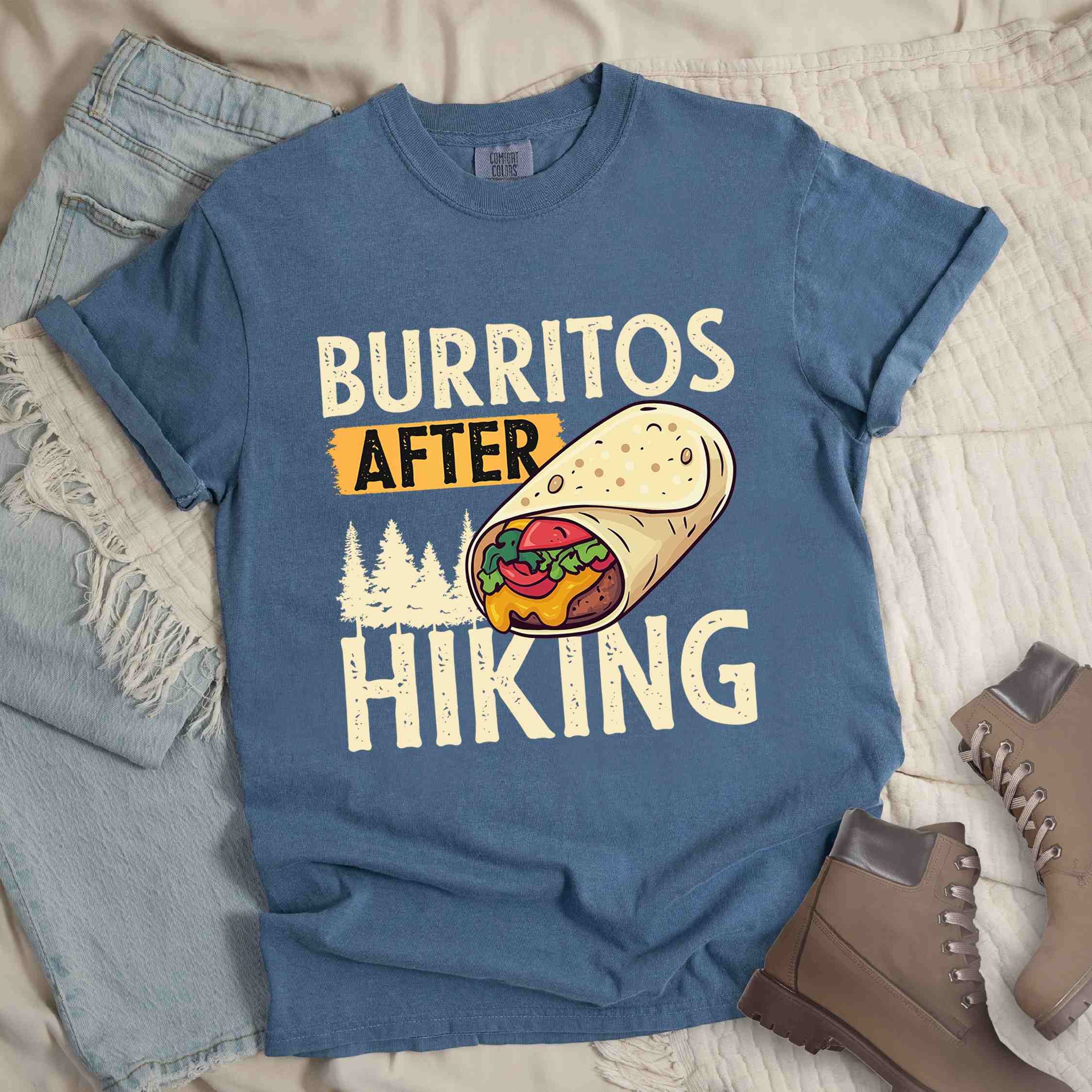 blue jean "burritos after hiking" colored vintage tee with bold typography, birds, trees, illustrated wrapped burrito, and backpacker for burrito enthusiasts.