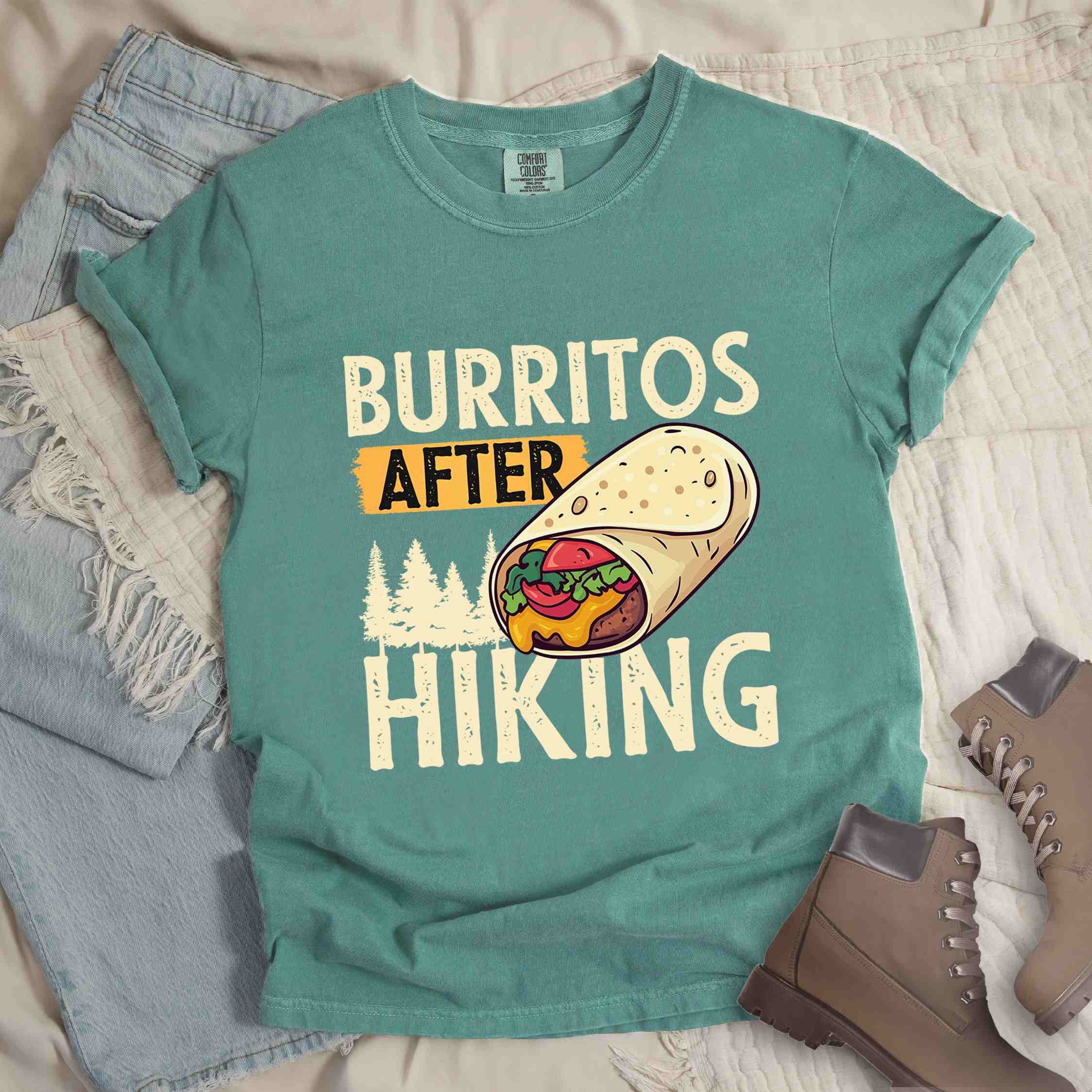 Light green "burritos after hiking" colored vintage tee with bold typography, birds, trees, illustrated wrapped burrito, and backpacker for burrito enthusiasts.