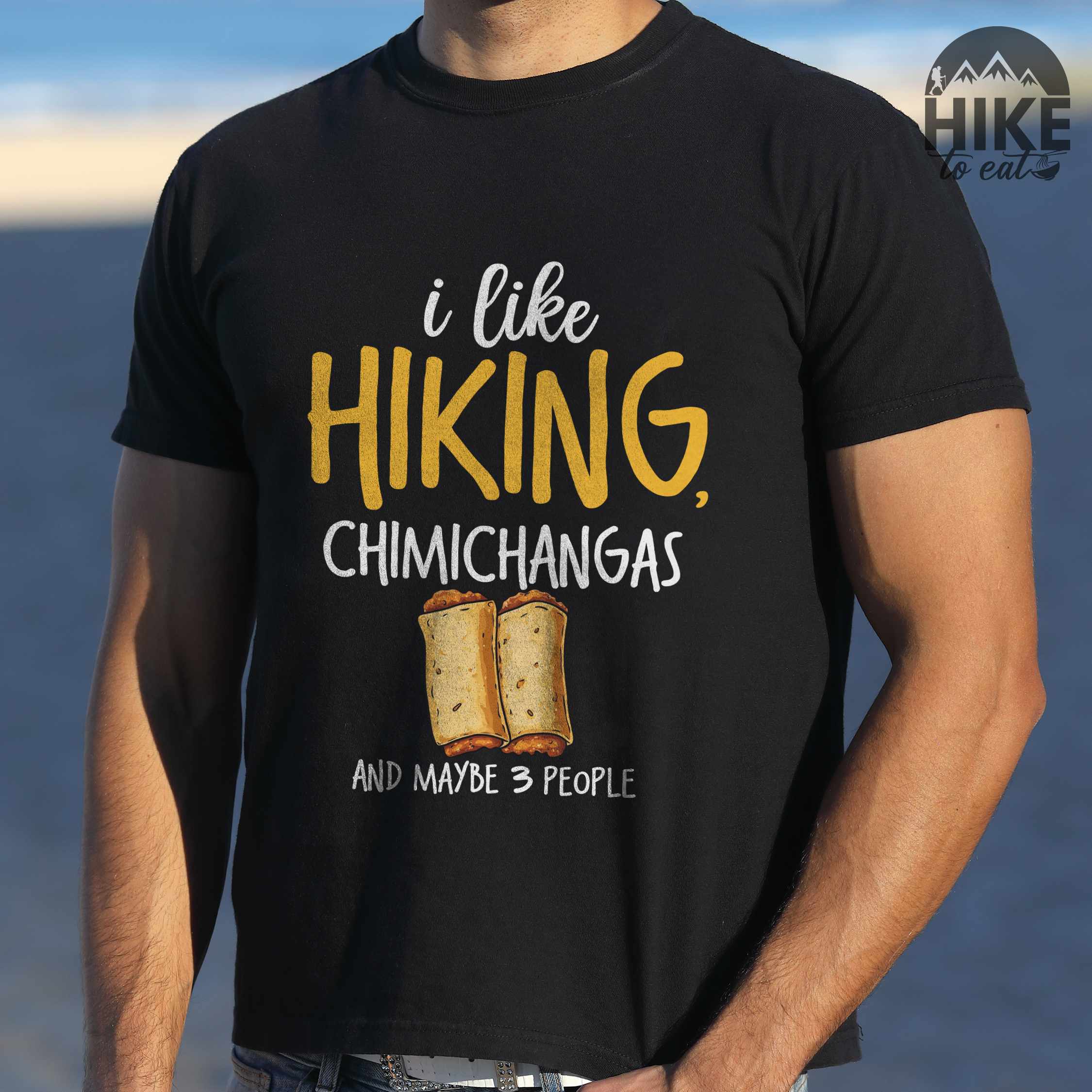 Man wearing black "I like hiking, chimichangas and maybe like 3 people" colored vintage tee with bold typography, illustrated chimichangas, perfect for chimichangas enthusiasts.