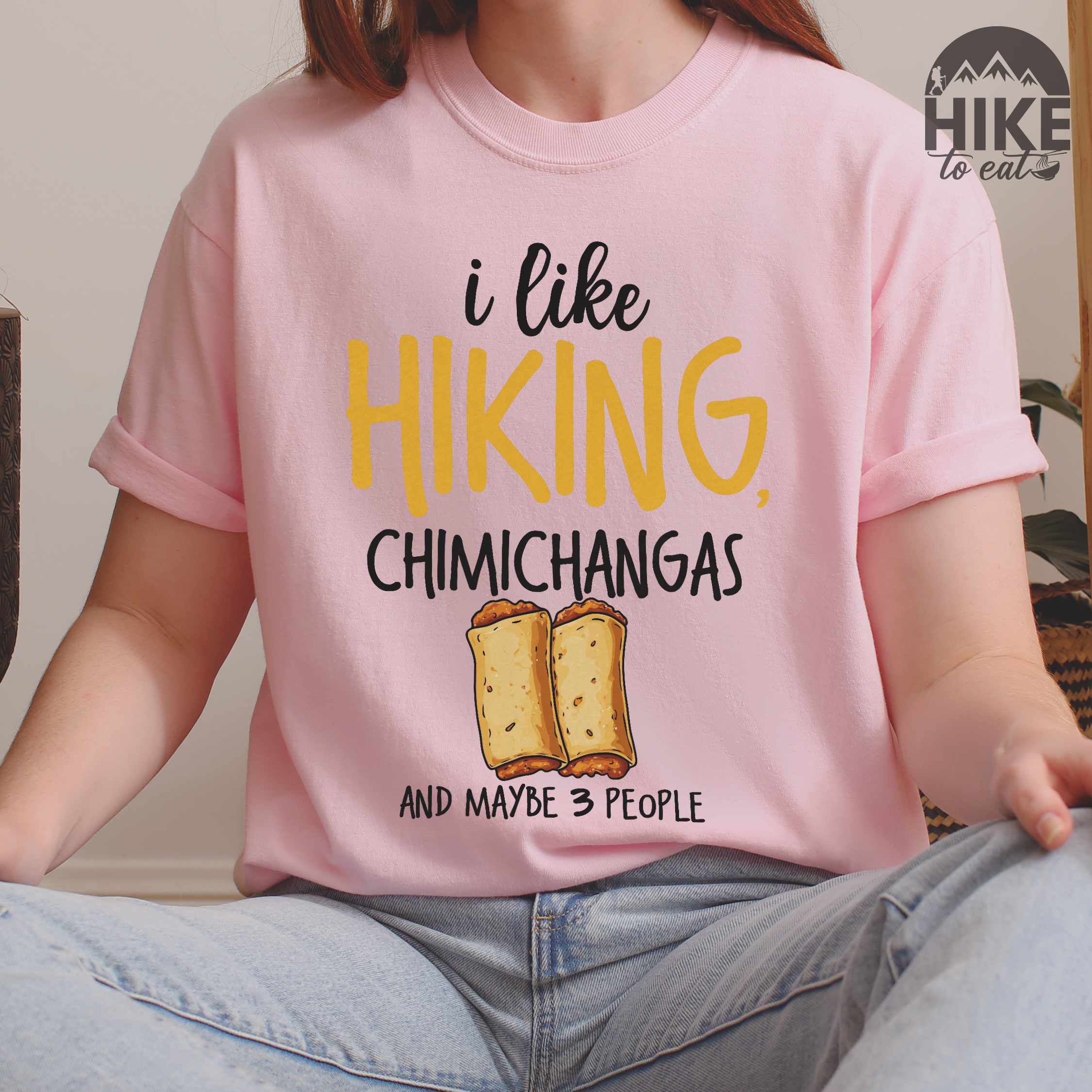 Woman wearing blossom "I like hiking, chimichangas and maybe like 3 people" colored vintage tee with bold typography, illustrated chimichangas, perfect for chimichangas enthusiasts.