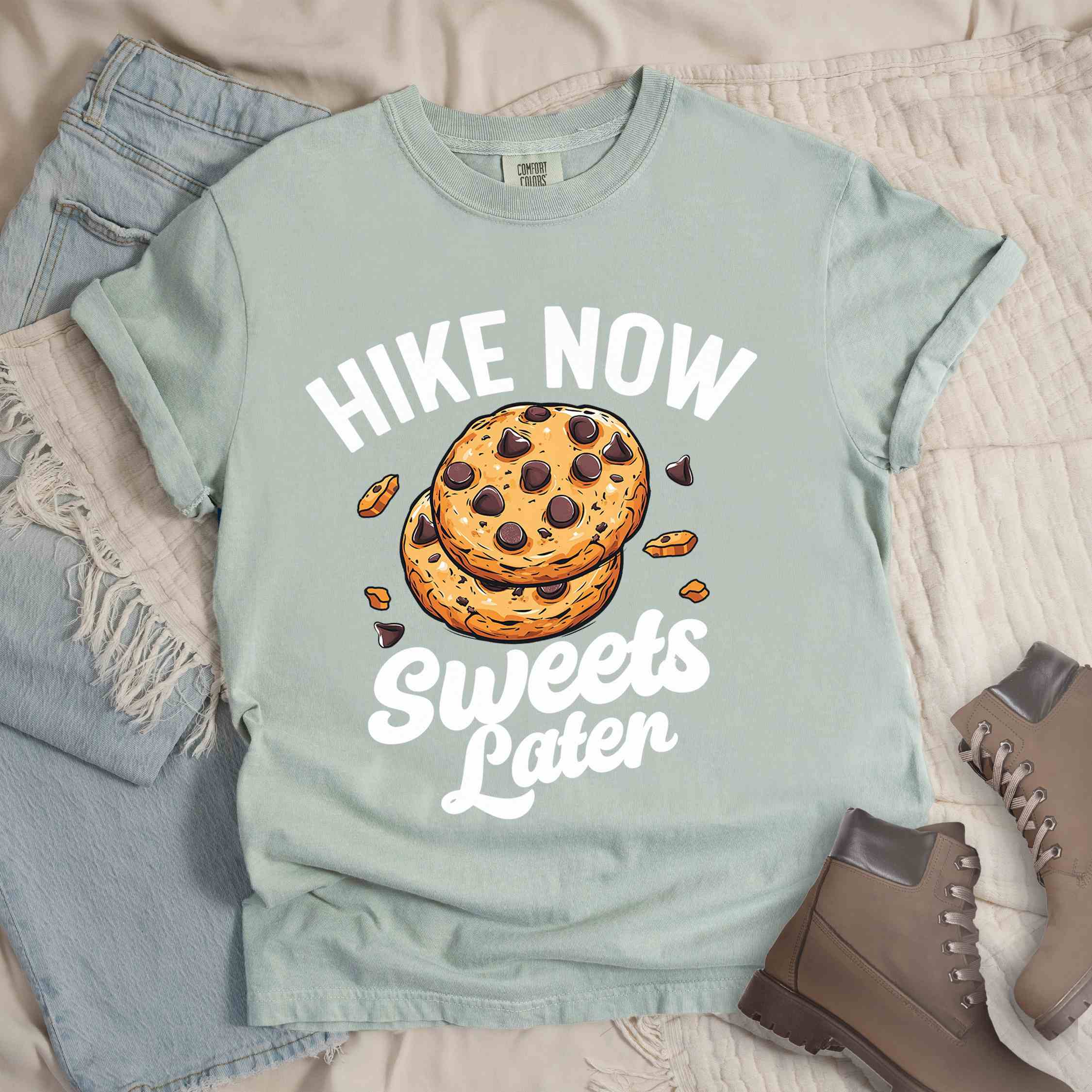 Bay “Hike Now Sweets Later” colored vintage tee with bold and script typography, illustration of chocolate chip cookies with crumbs scattered around. Perfect for cookie lovers.
